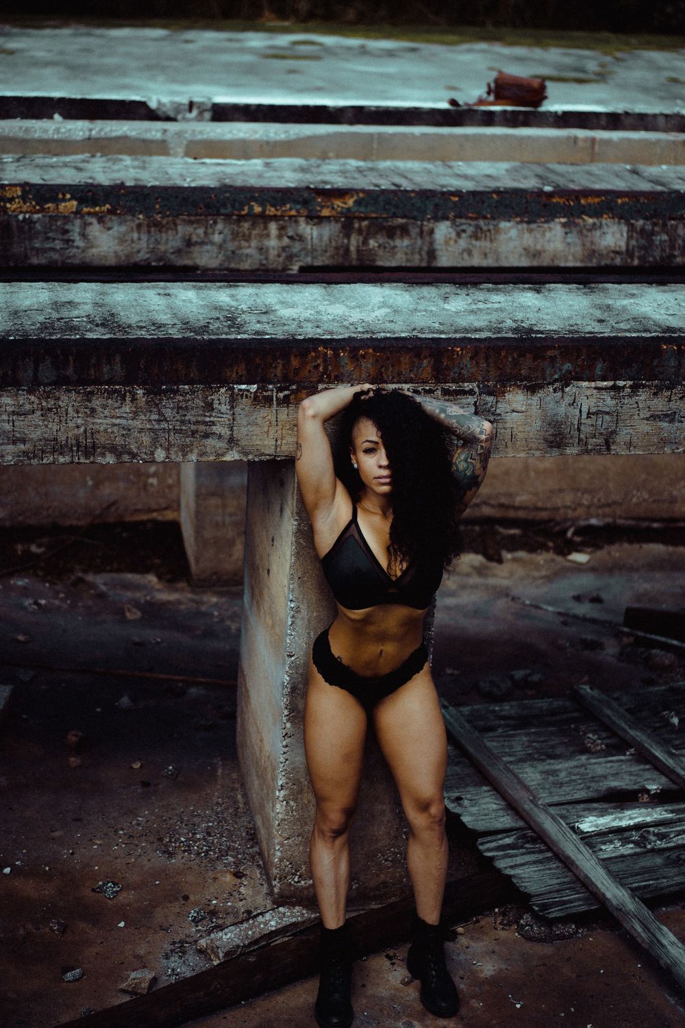 Artistic photo series showing silhouetted figure in dark industrial setting.