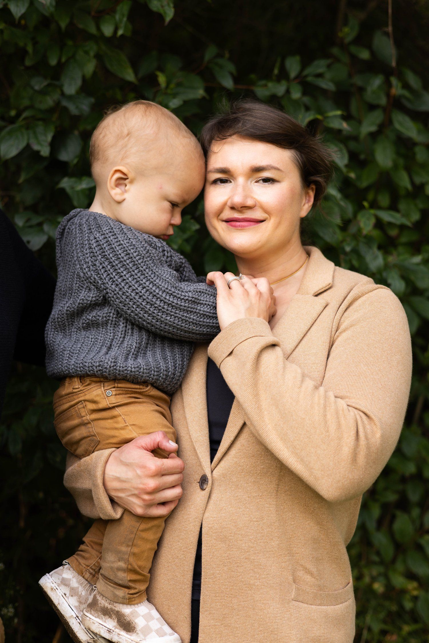 Mother holding baby boy outdoors photography