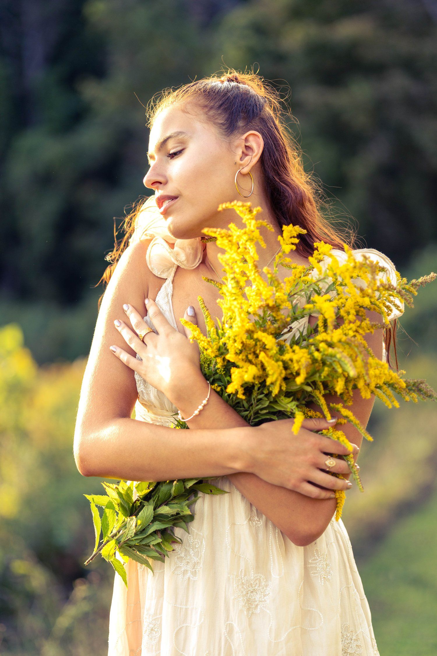 Woman holding yellow wildflower bouquet photography