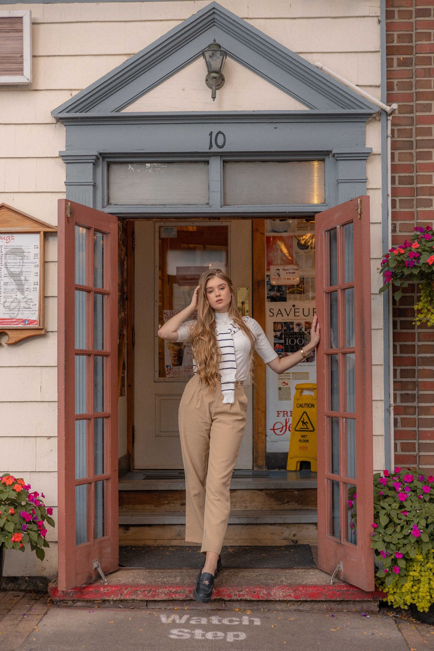 Model posing open restaurant doorway photography
