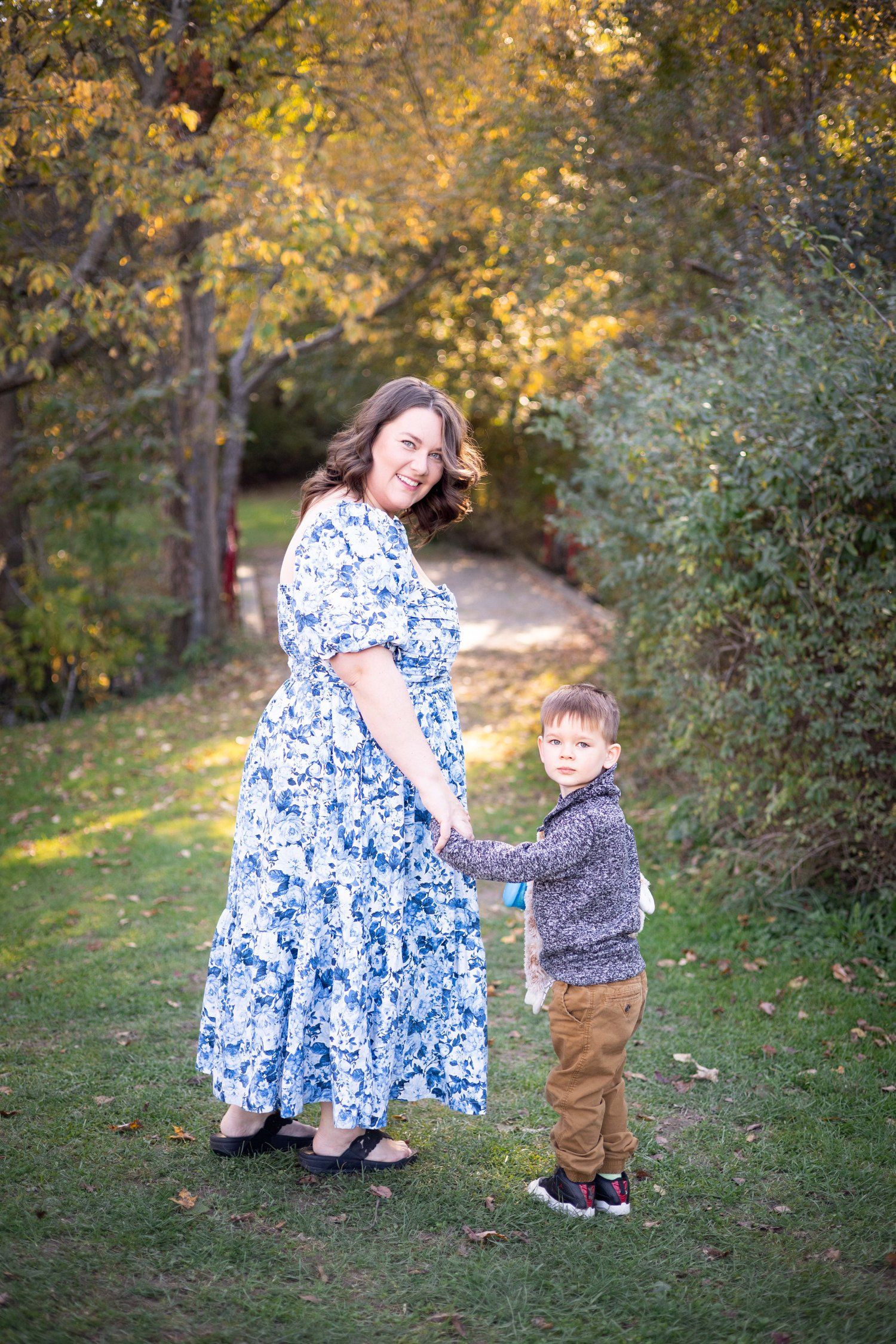 Mother son holding hands autumn photography
