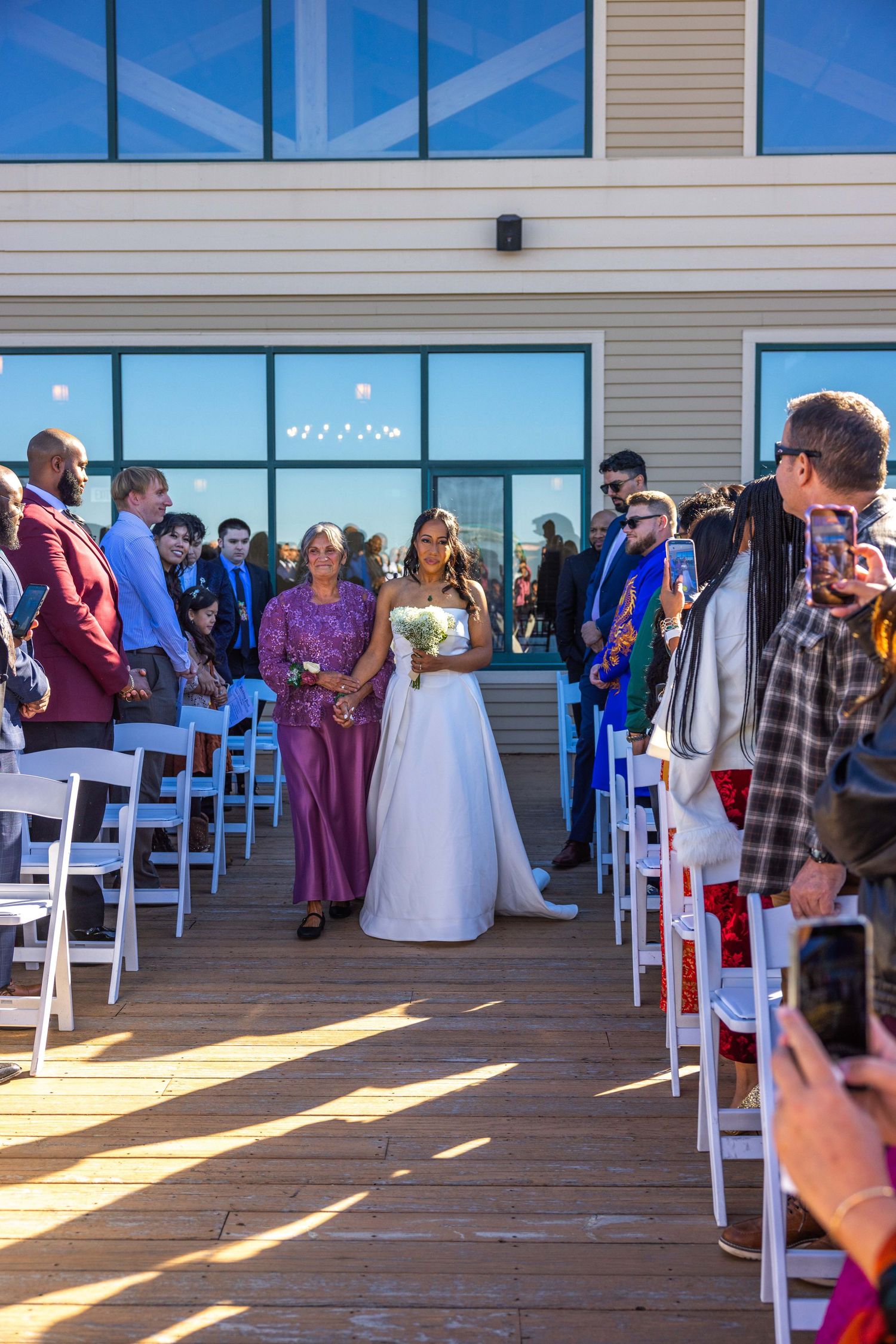 Bride walking down aisle outdoors photography