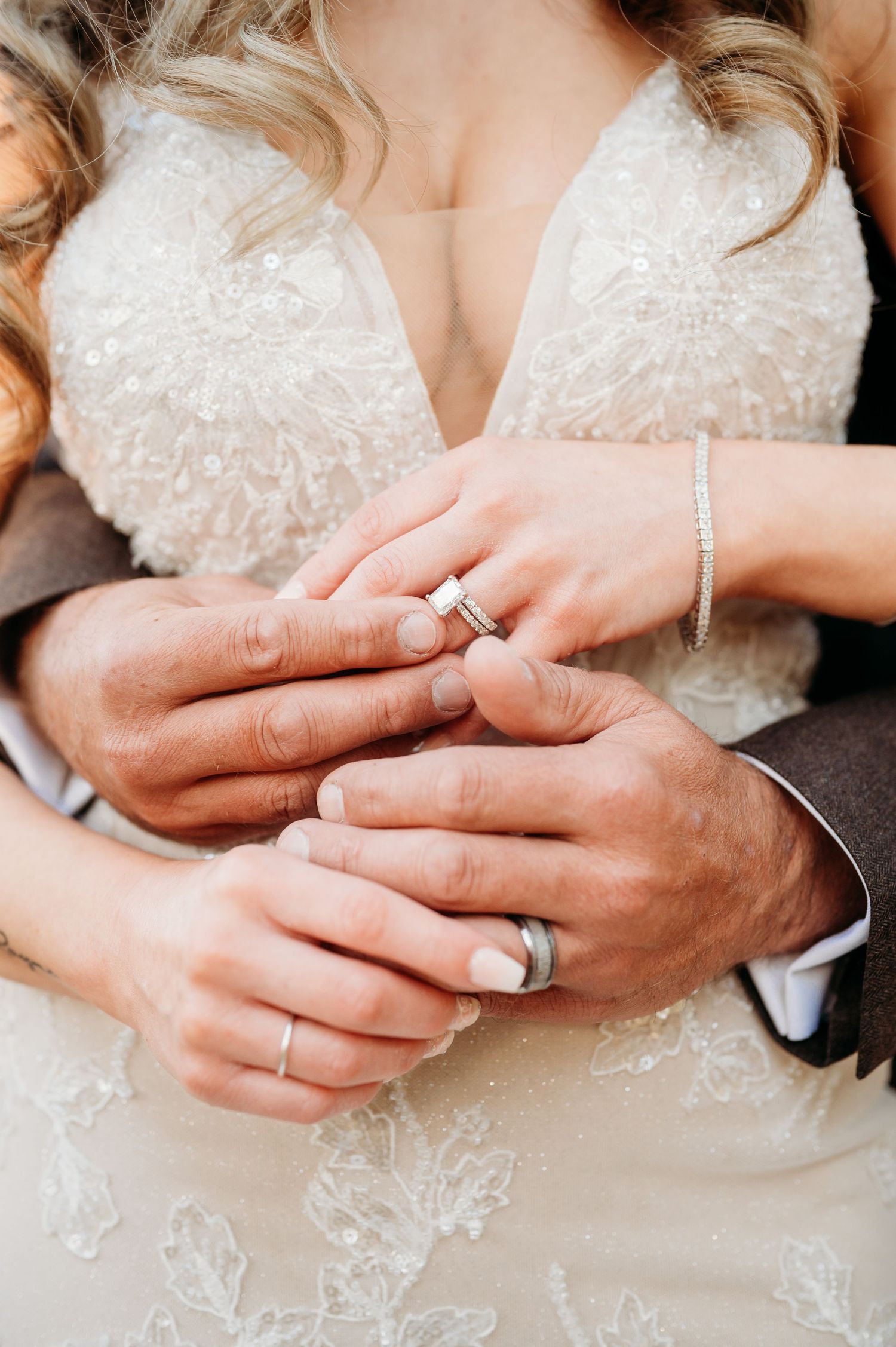 Close-up sequence of hands exchanging wedding rings during ceremony.