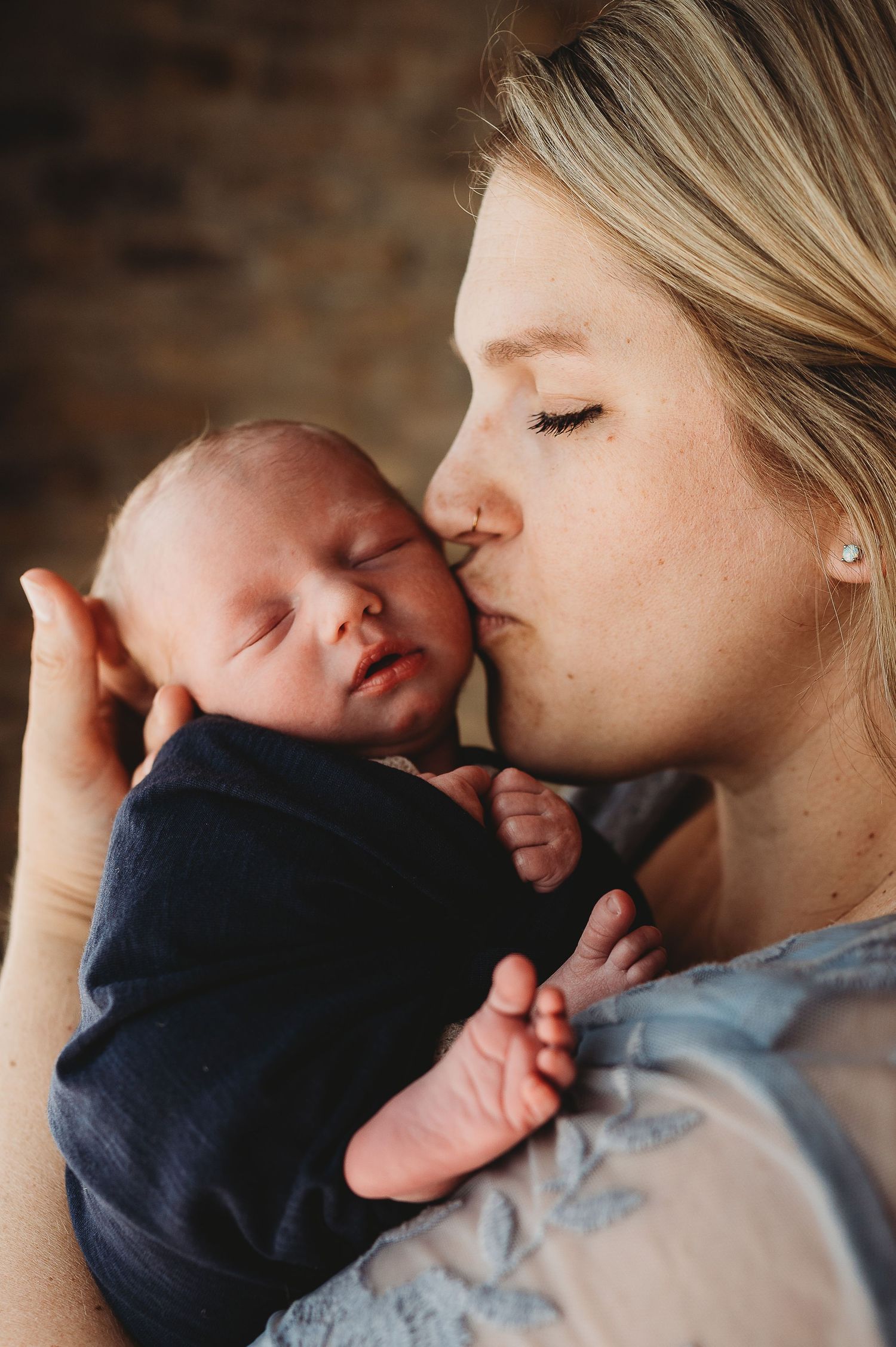 Tender newborn photography moments captured in intimate close-up shots.