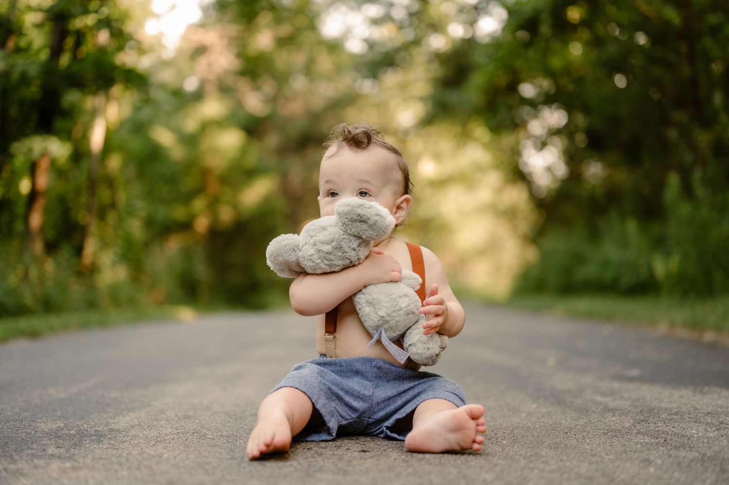 Bare feet resting on concrete path during outdoor photoshoot.
