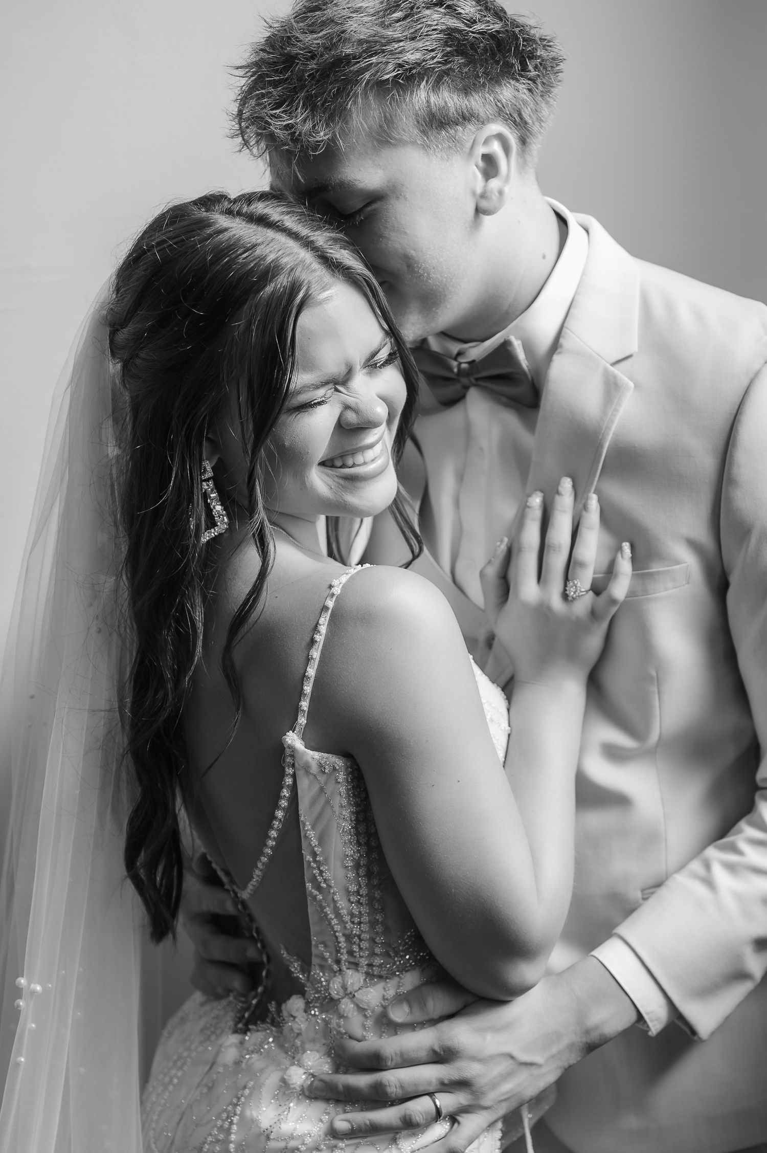 A romantic black and white photo series showing tender moments between a bride and groom in intimate poses captured by Jessica Sagerty.