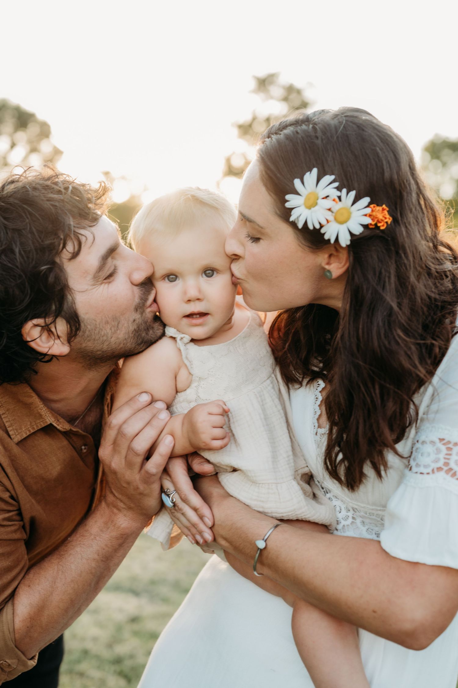 A series of five tender family photos showing loving kisses and embraces outdoors during golden hour.