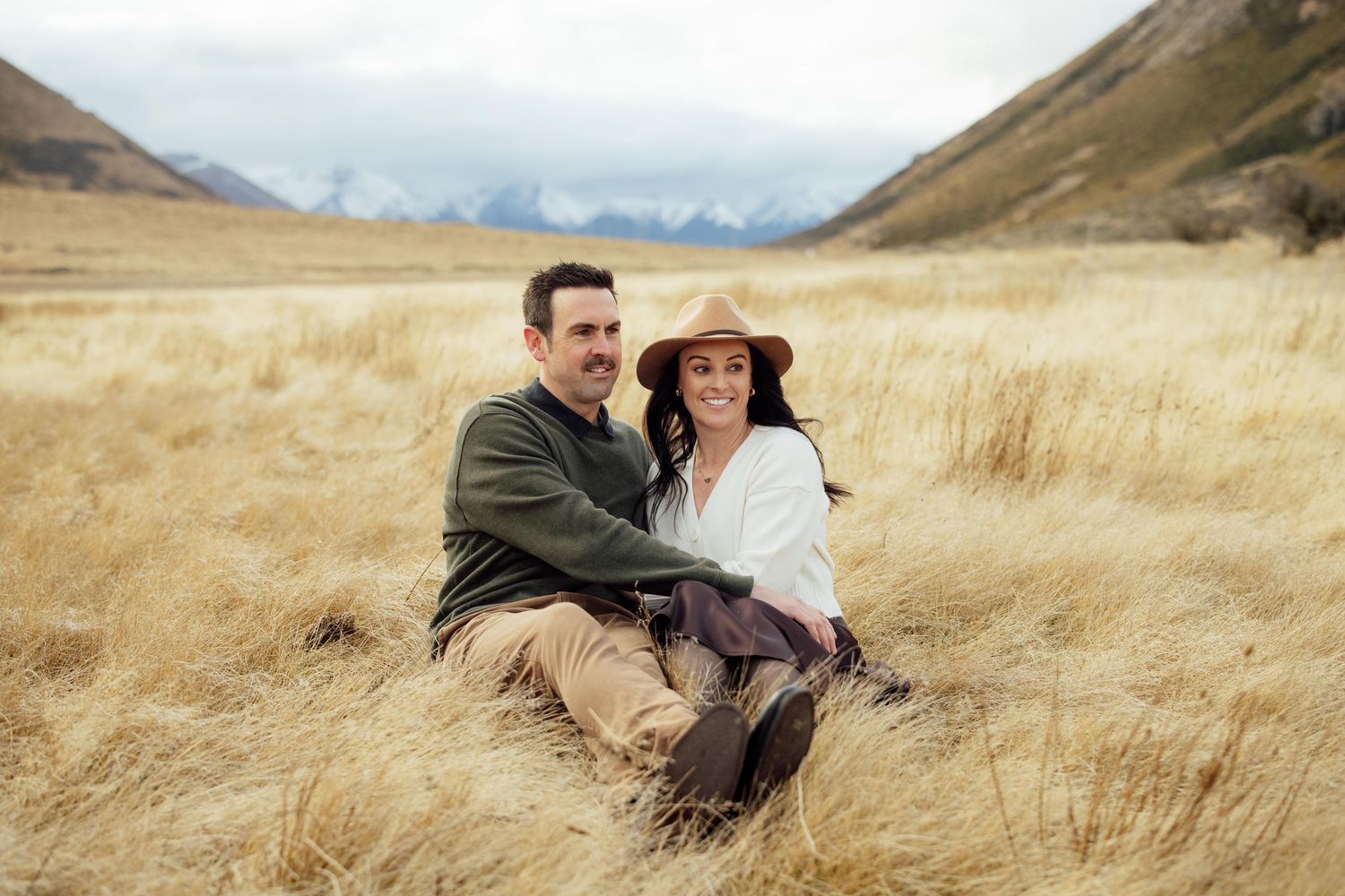 Couple in the mountains having an engagement photo session during winter in Canterbury, NZ,