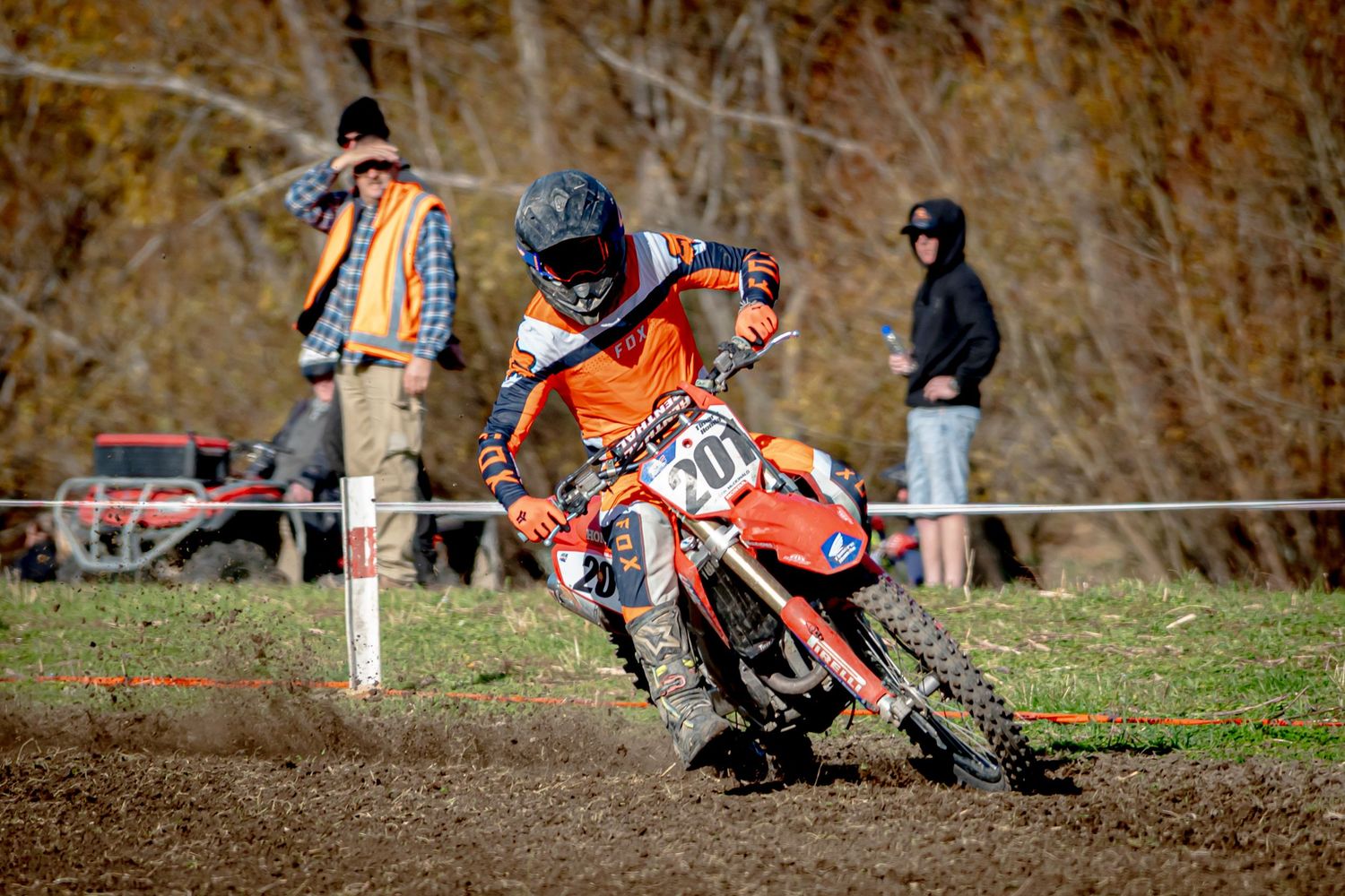 Motocross racers battle for position through a series of tight turns on a dirt track at the Michael Godfrey Memorial Race 2025.
