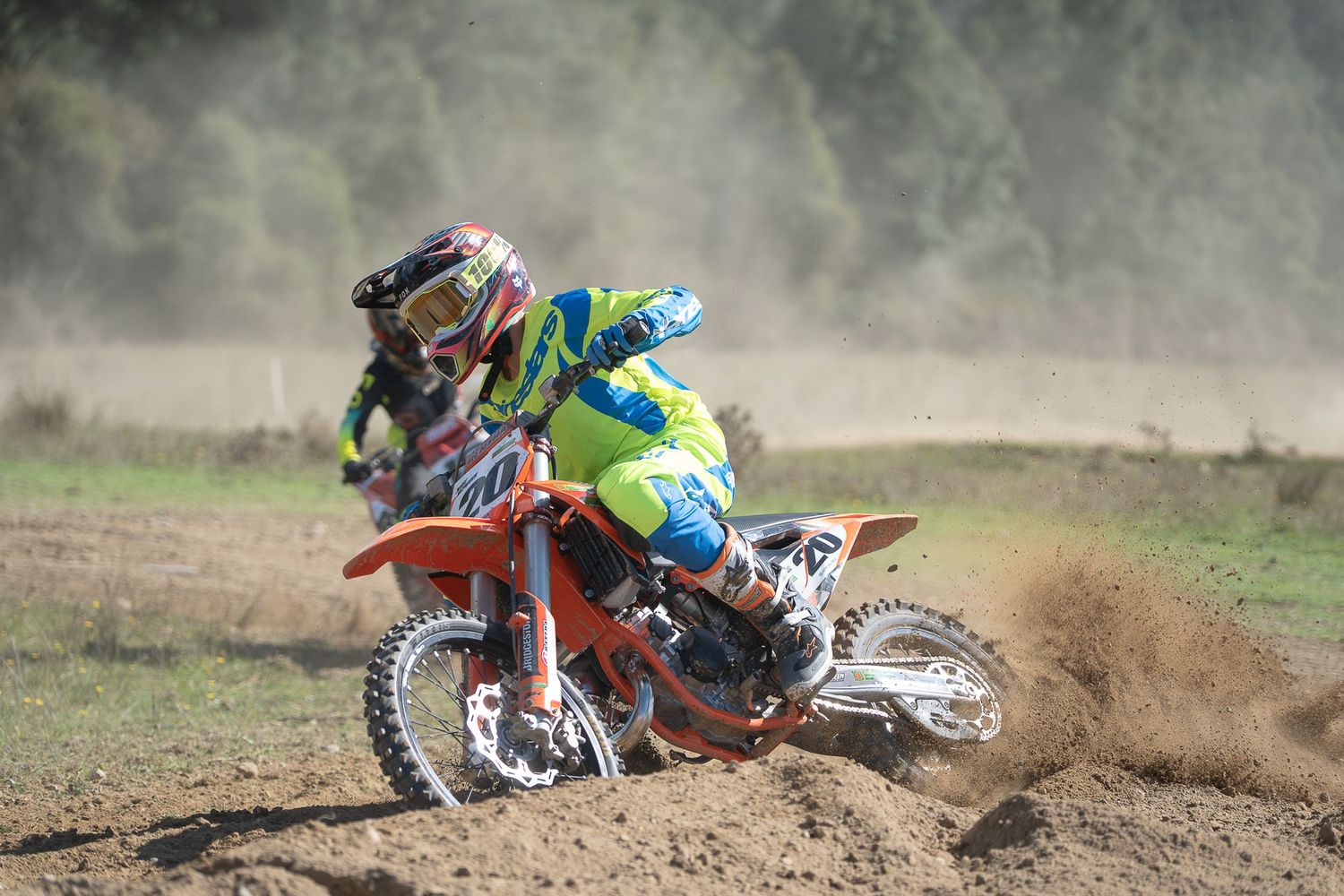 Motocross rider kicks up dust while racing on the West Coast of New Zealand.