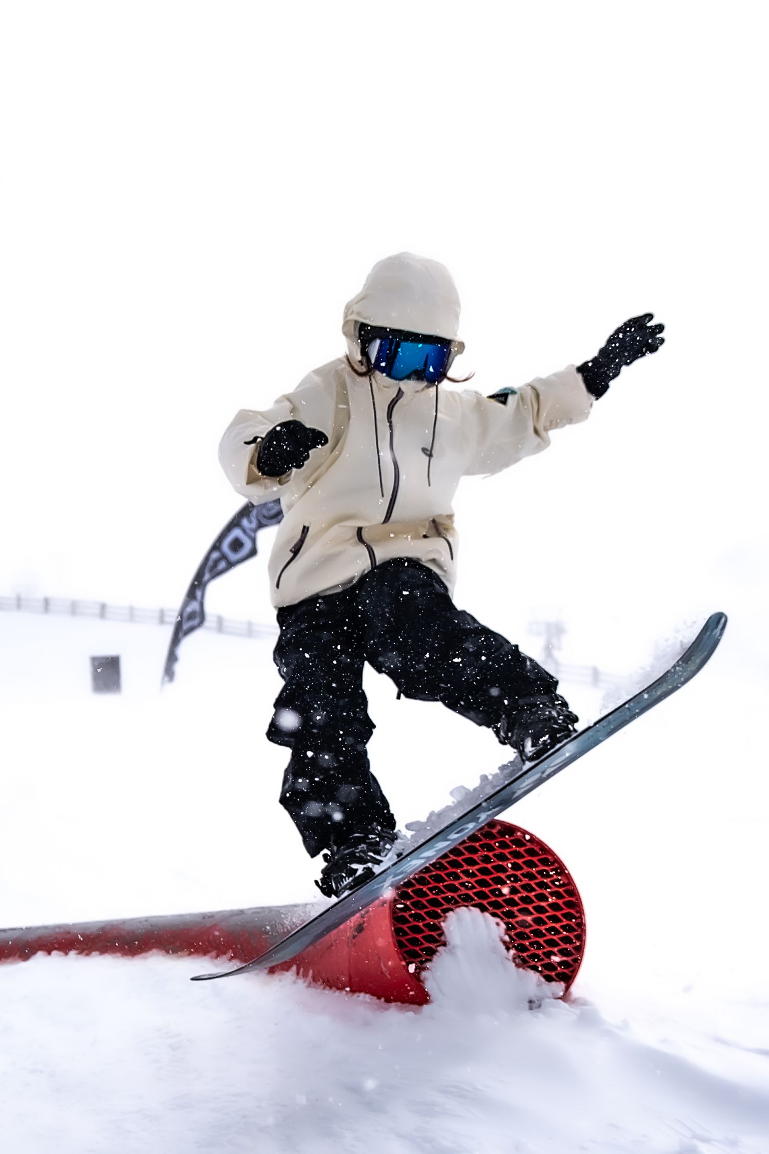 A sequence of snowboarding action shots showing a rider performing aerial tricks off a jump in snowy conditions at Cardrona Alpine Report.