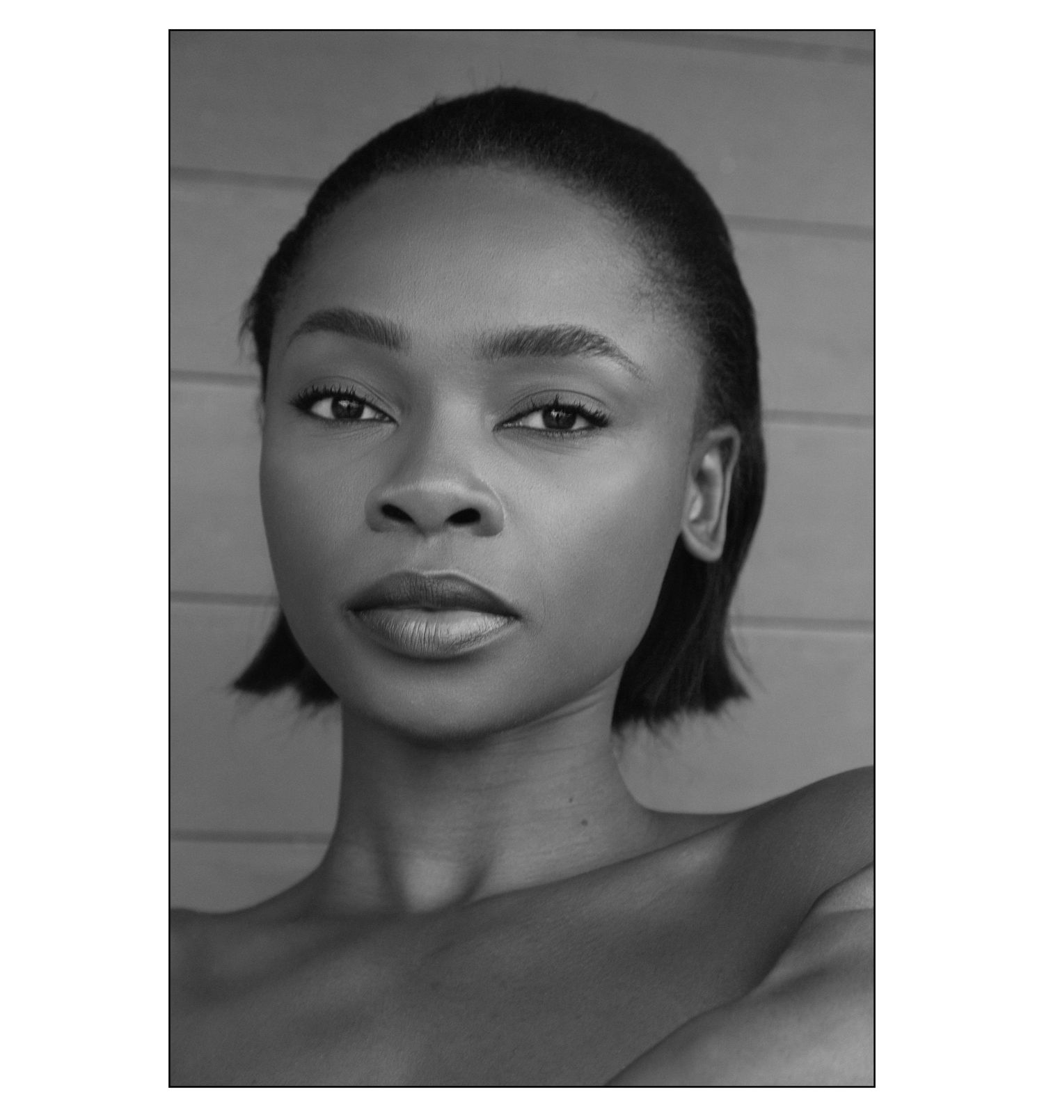 Black and white portrait series showing artistic headshots with dramatic lighting and shadows.