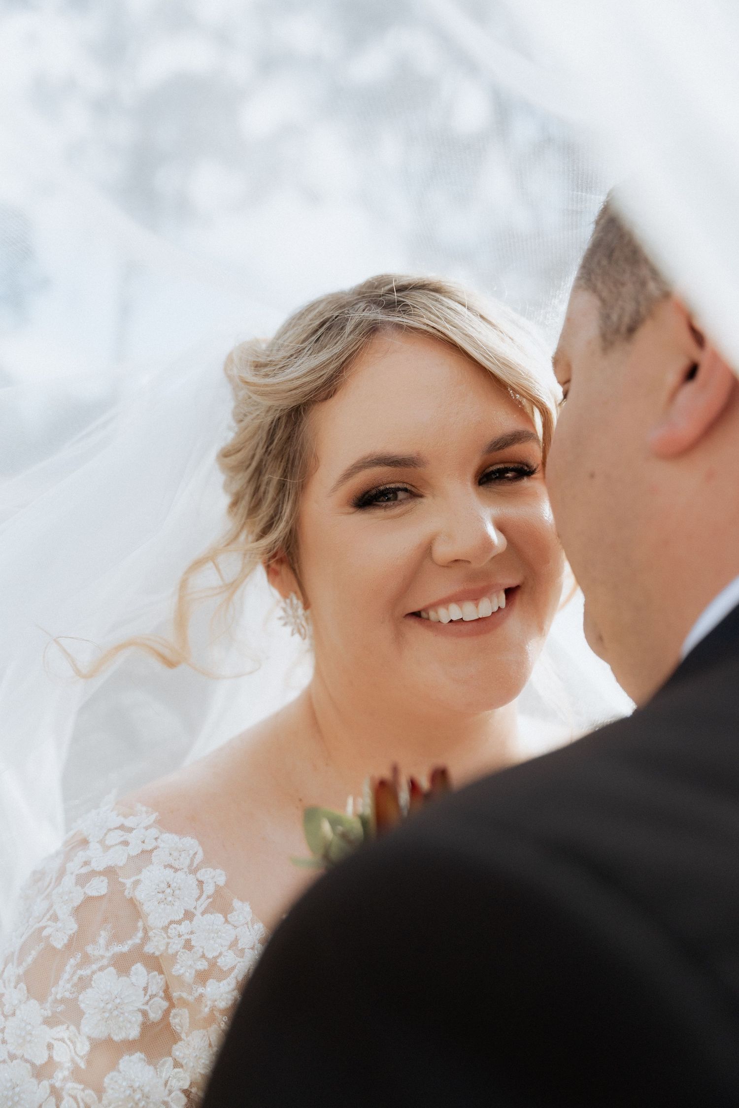 Close-up wedding portraits showing tender moments between newlyweds.