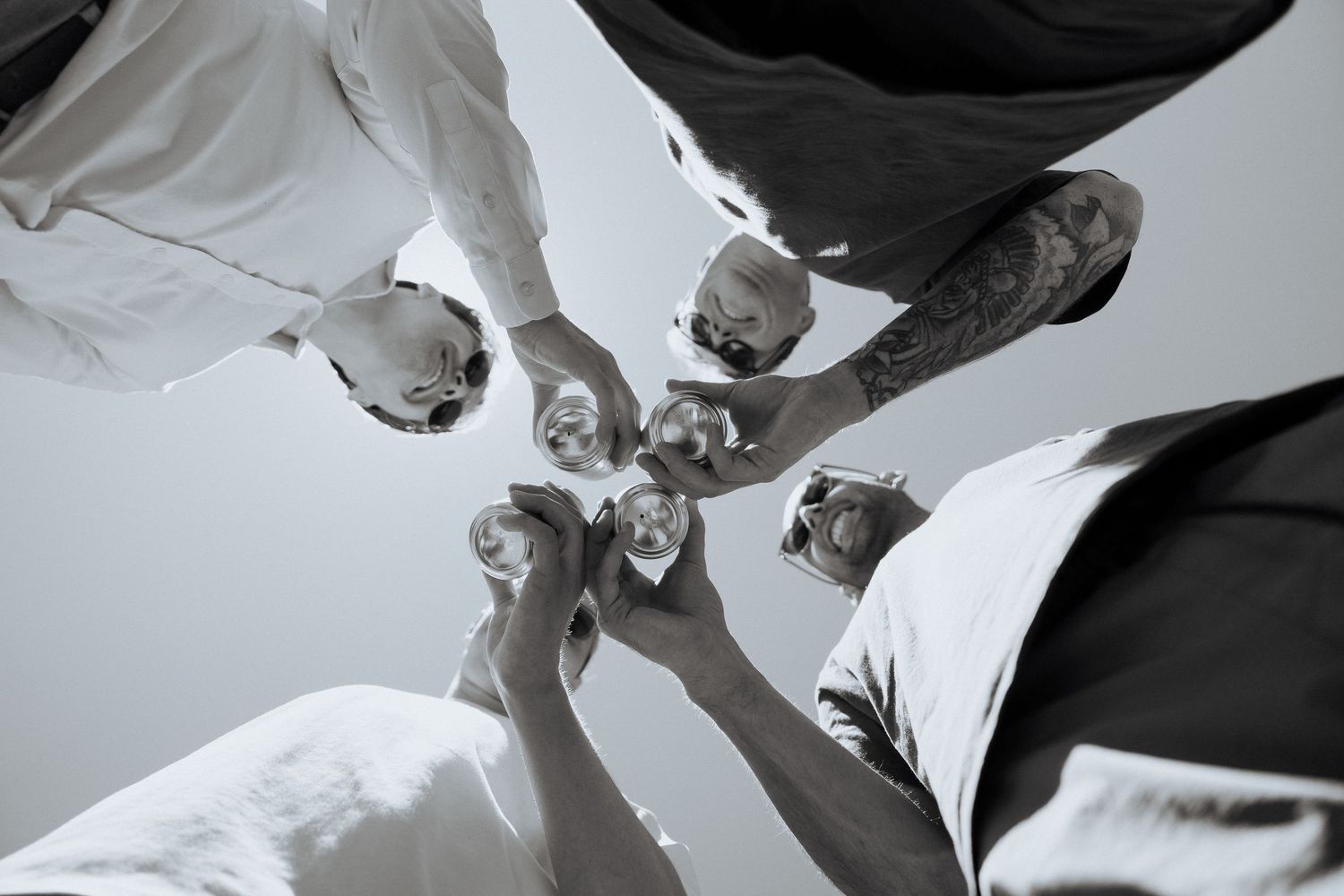 Abstract black and white photos showing fabric in motion against a light background.