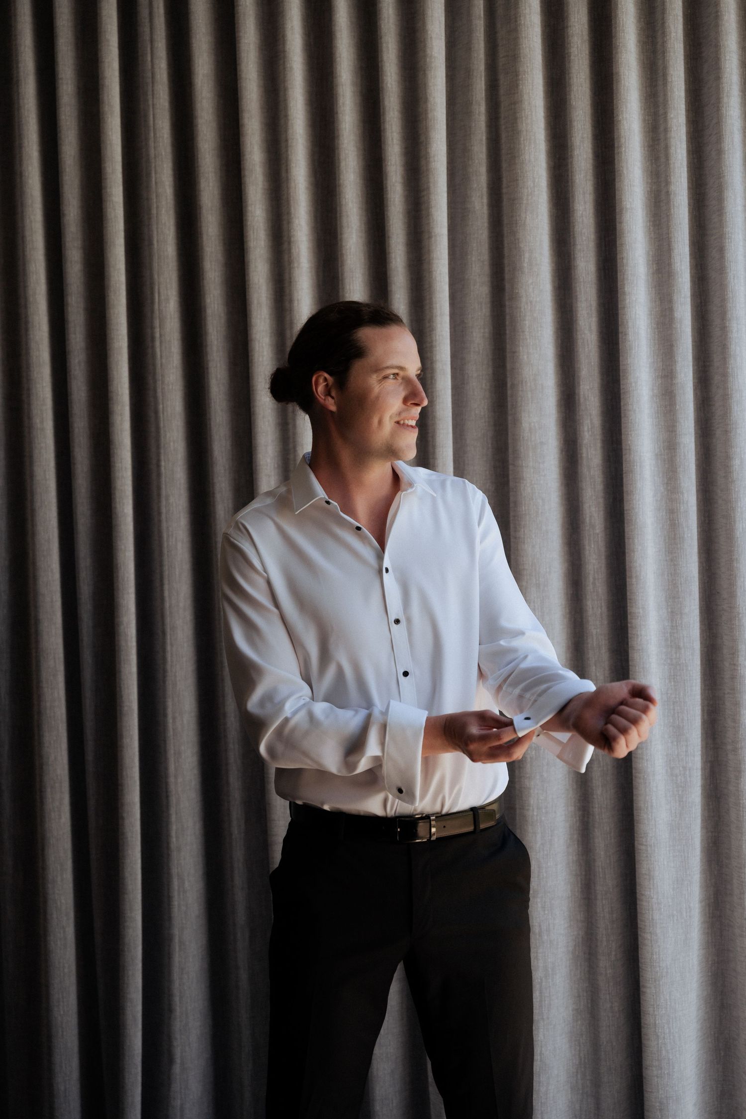 A series of candid portrait shots showing preparation moments against a light curtained backdrop.