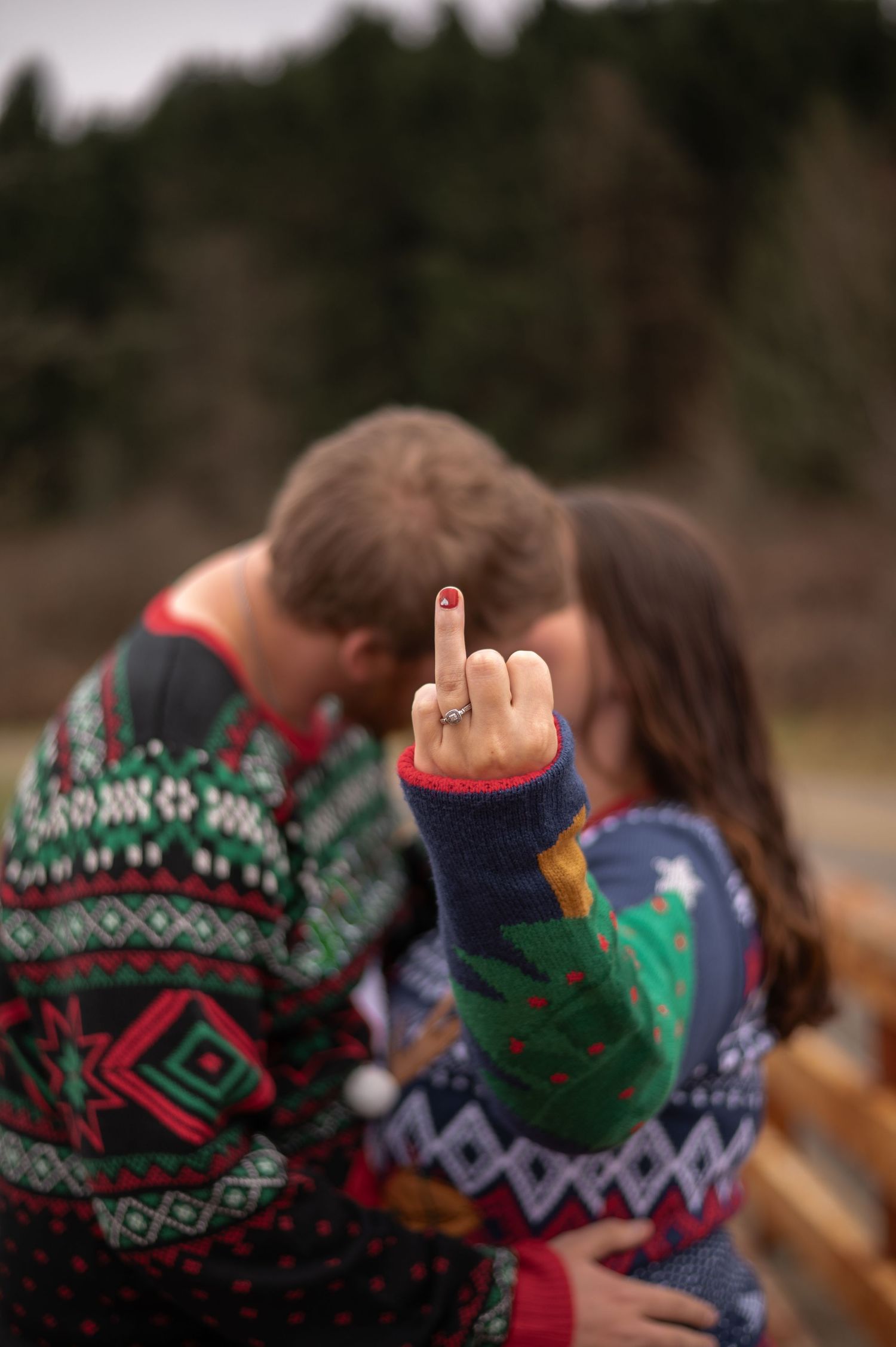 Cozy knit winter sweaters with festive geometric patterns and snowflake designs shown in close-up detail.