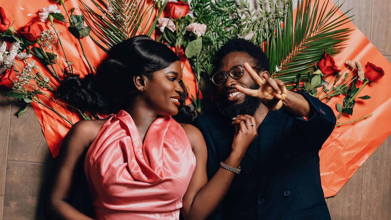 Five connected images show a couple in romantic poses against a coral-colored background with tropical palm leaves.