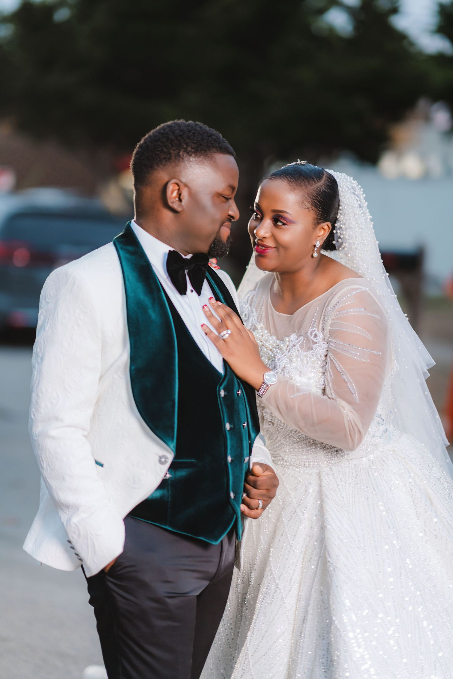 A romantic wedding photo series showing tender moments between newlyweds in white and teal attire.