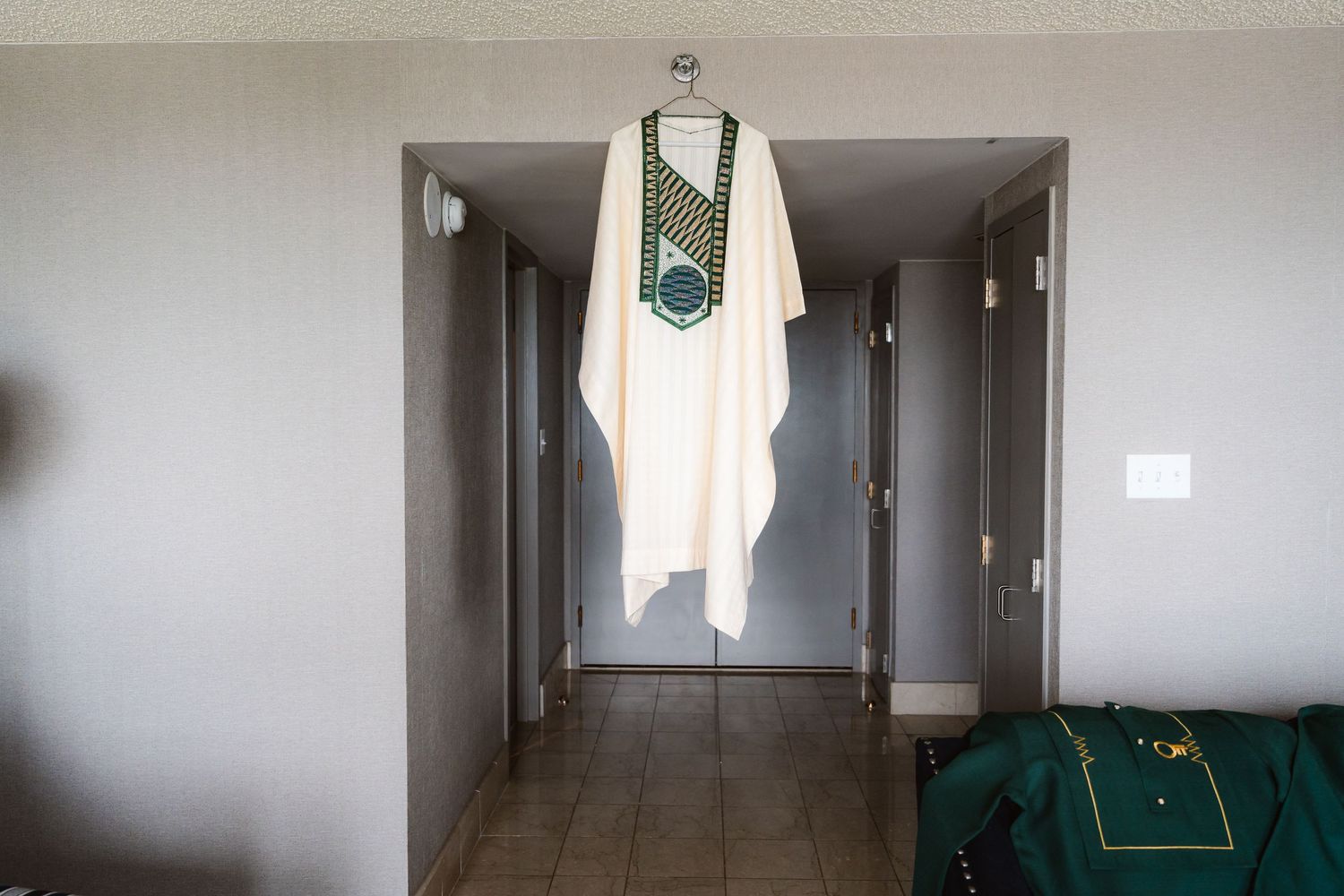Empty hallway interior with white walls and natural lighting.