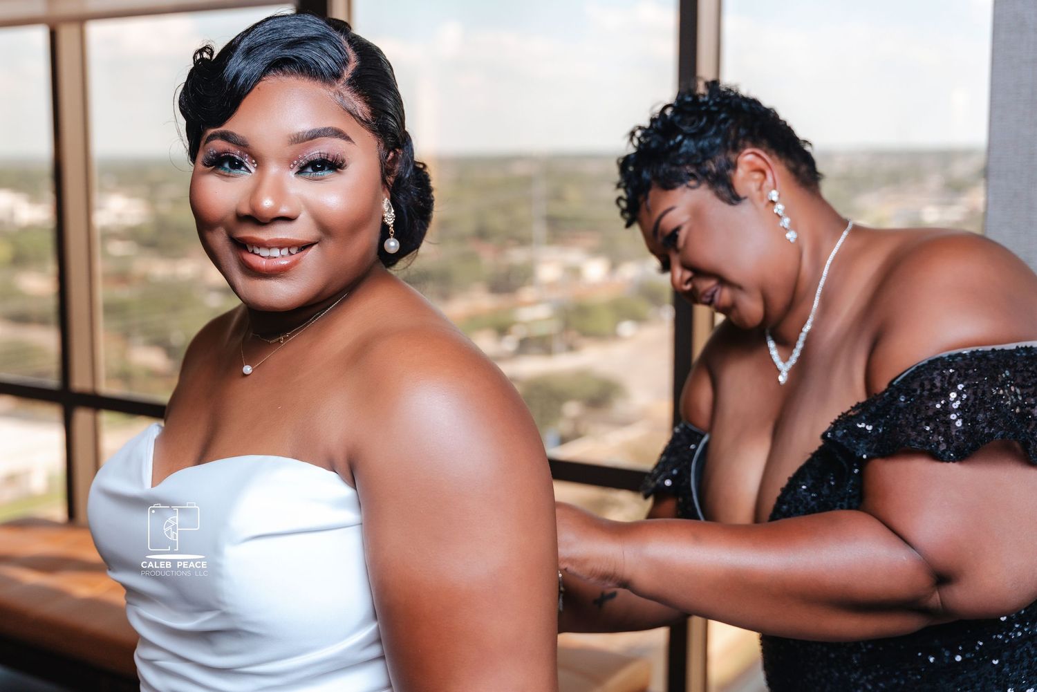 Wedding party members sharing joyful moments during formal photography session.
