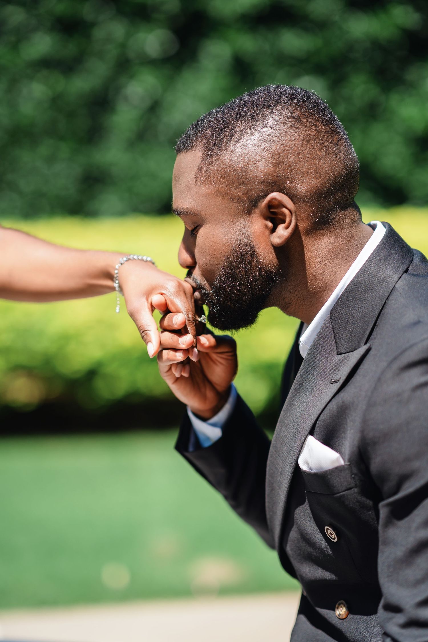 A sequence showing joyful reactions and laughter during an outdoor wedding celebration.