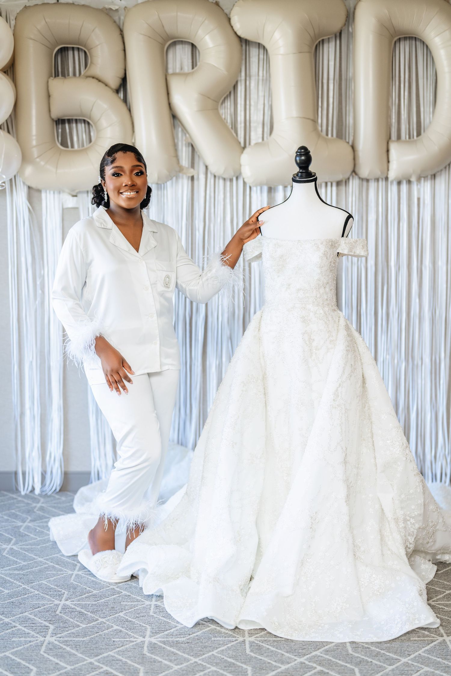 A series of wedding photos showing an elegant white bridal gown with silver balloons and white curtains in the background.