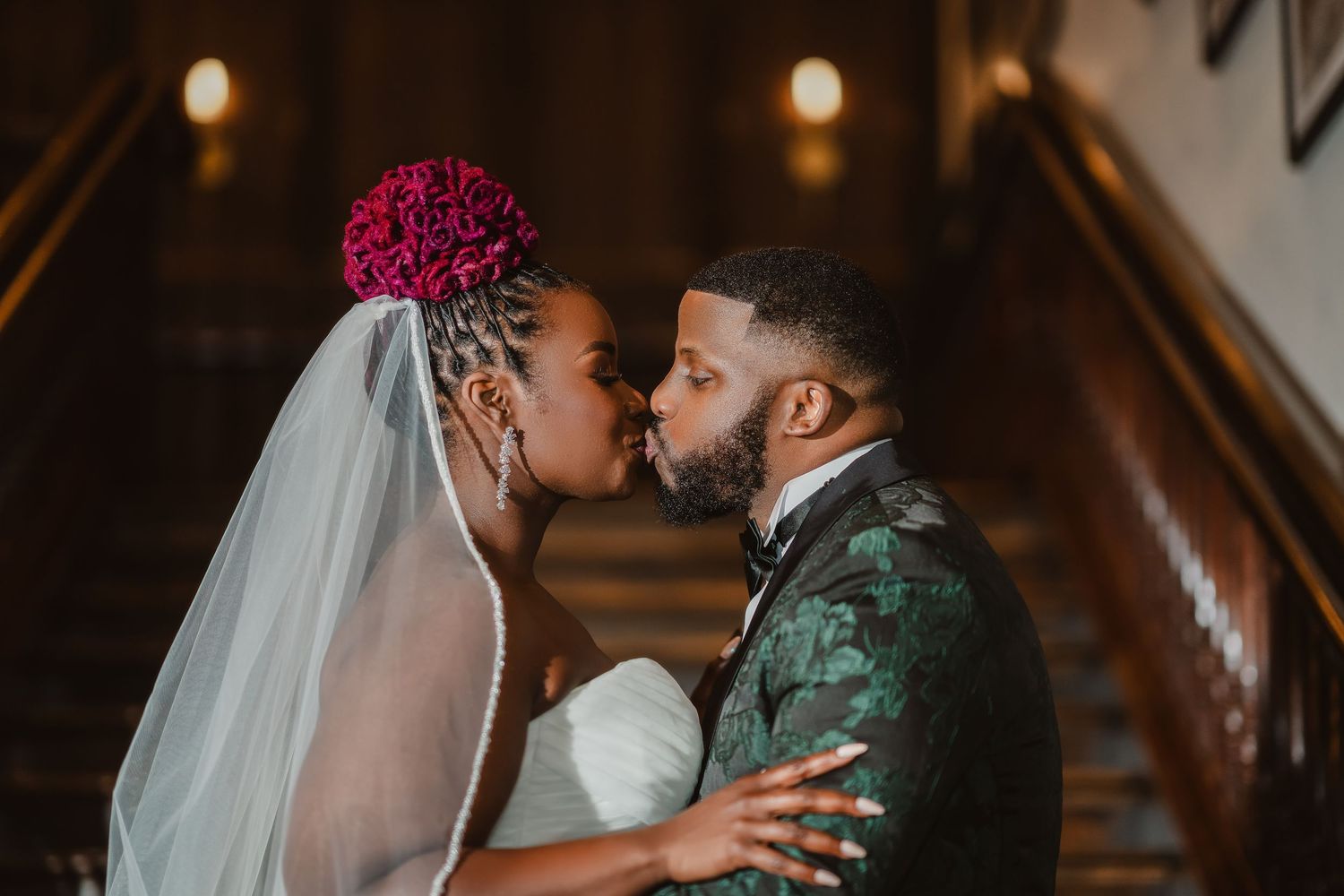 Intimate wedding moments captured in dramatic low-light setting.