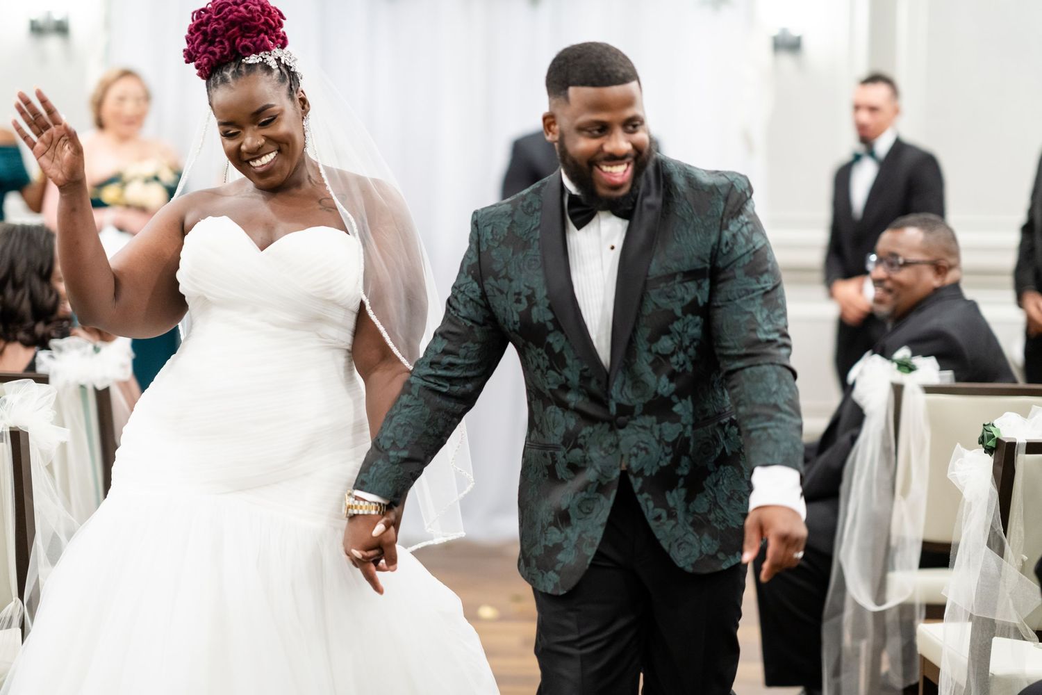 Candid wedding celebration moments captured in a bright indoor venue.