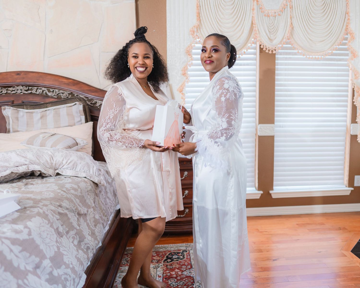 Bridal preparation scene with white lace wedding dress and joyful moments captured in natural light.