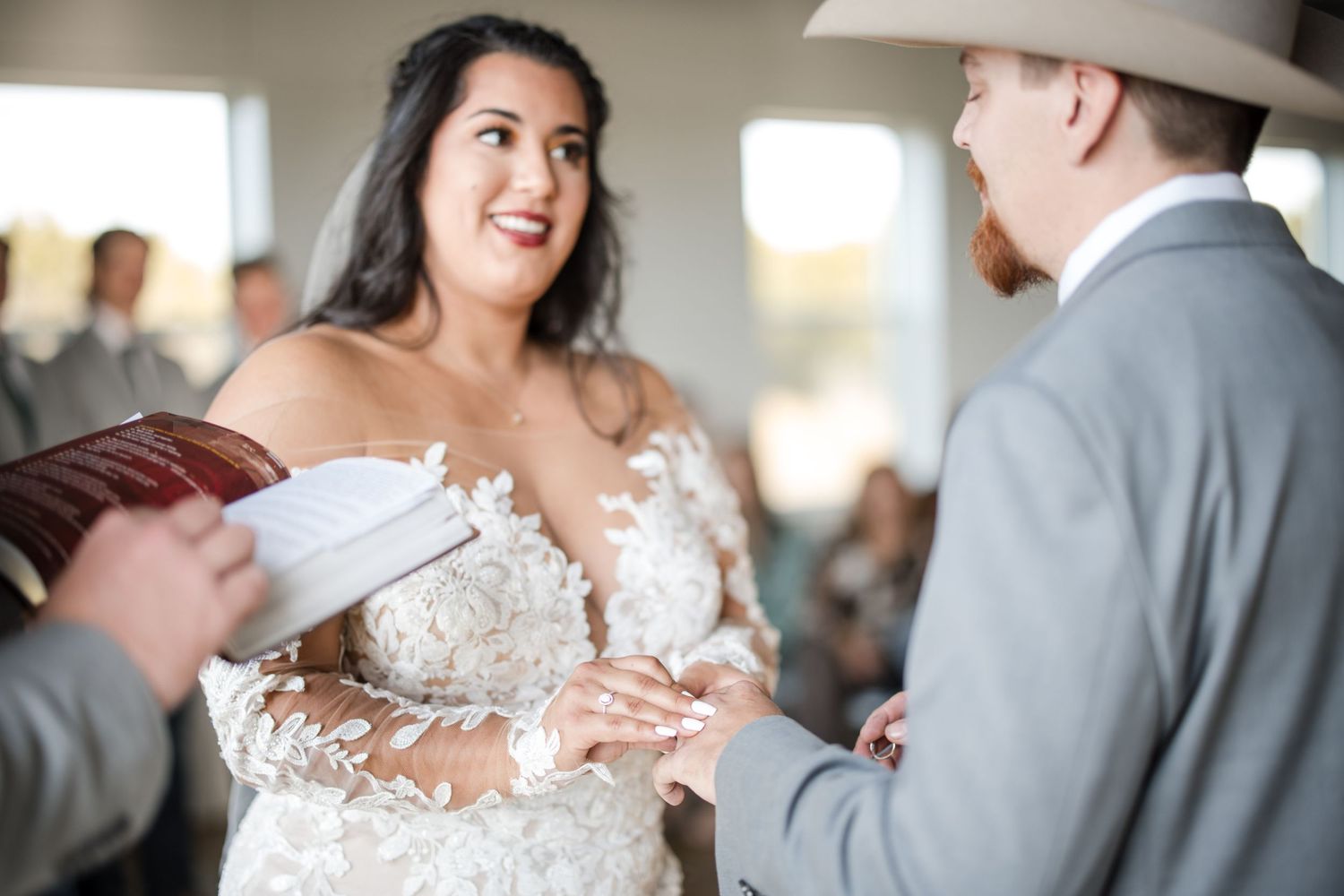 Intimate moments shared between wedding couple during their indoor reception celebration.