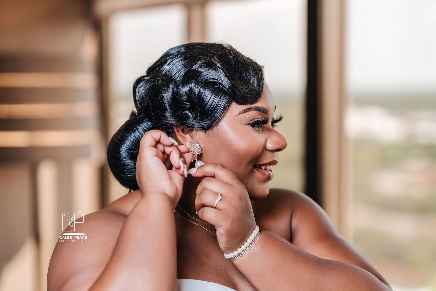 Elegant wedding details with sparkling jewelry and updo hairstyle.