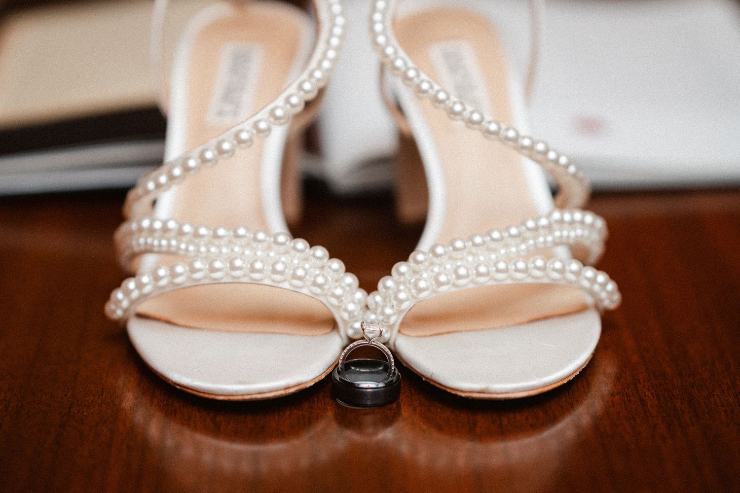 Elegant pearl-studded bridal sandals arranged in a stylish collage against a neutral background.