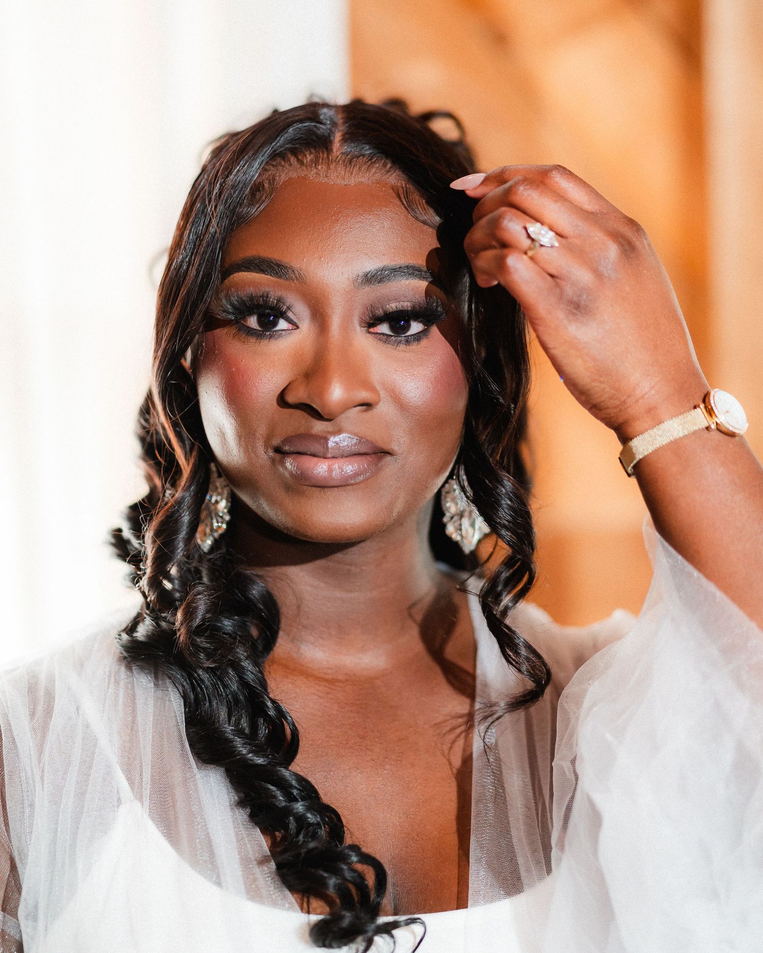 Close-up bridal portraits showing elegant makeup and hair styling details.