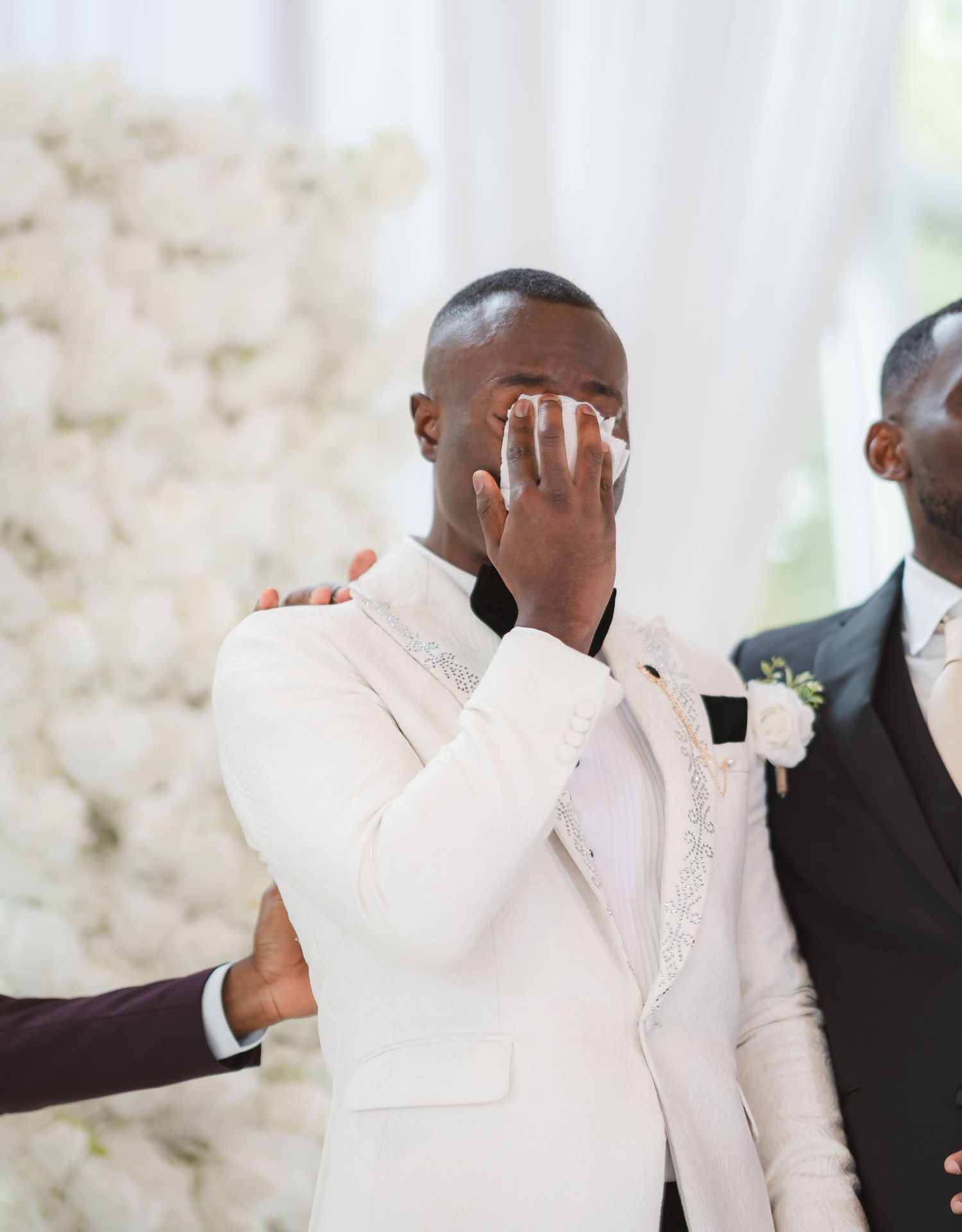 Wedding celebration sequence showing joyful dancing and movement in white attire.