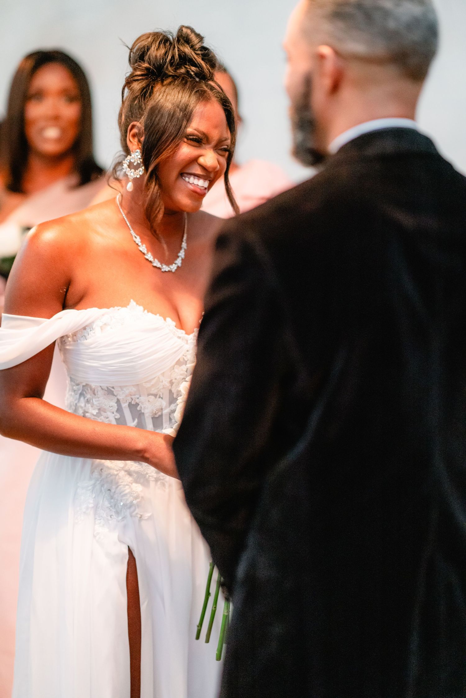 Candid moments captured during wedding ceremony showing joyful expressions.