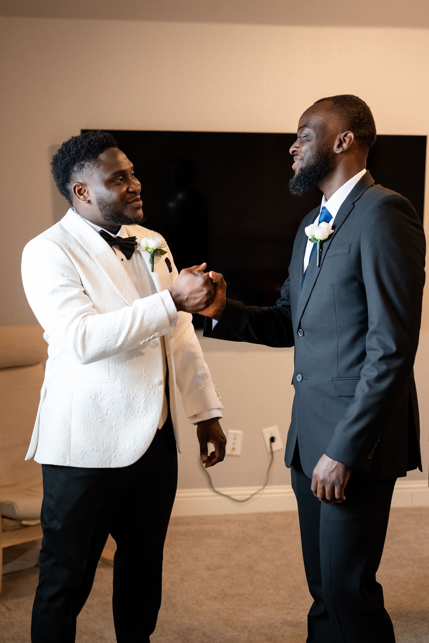 Two people in contrasting white and black formal attire interact animatedly in a sequence of candid moments.