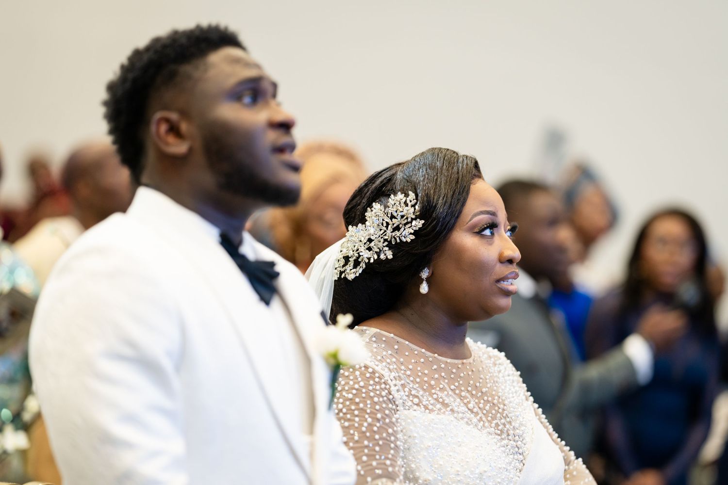 Wedding ceremony captures emotional moments between the couple and guests.