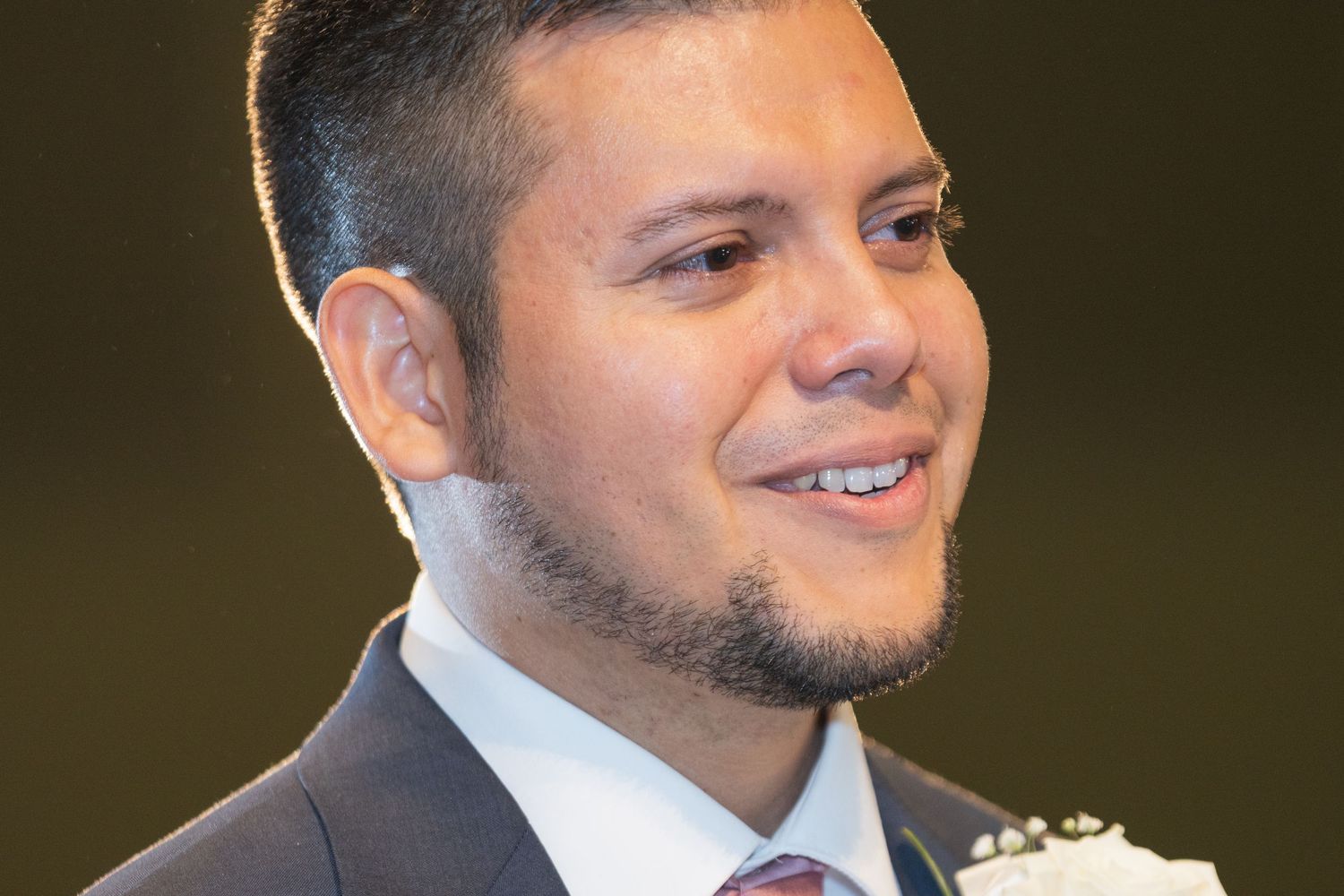 Close-up portrait shots showing joyful expressions against a dark background.