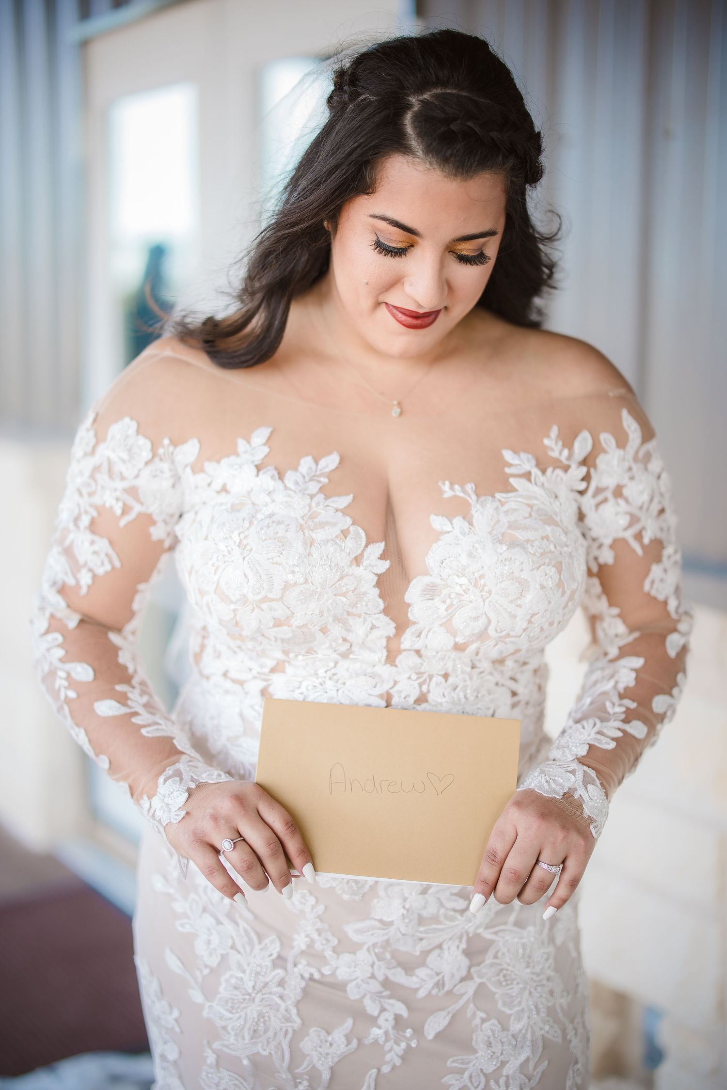 Close-up details of delicate white lace appliques on wedding dress bodice.