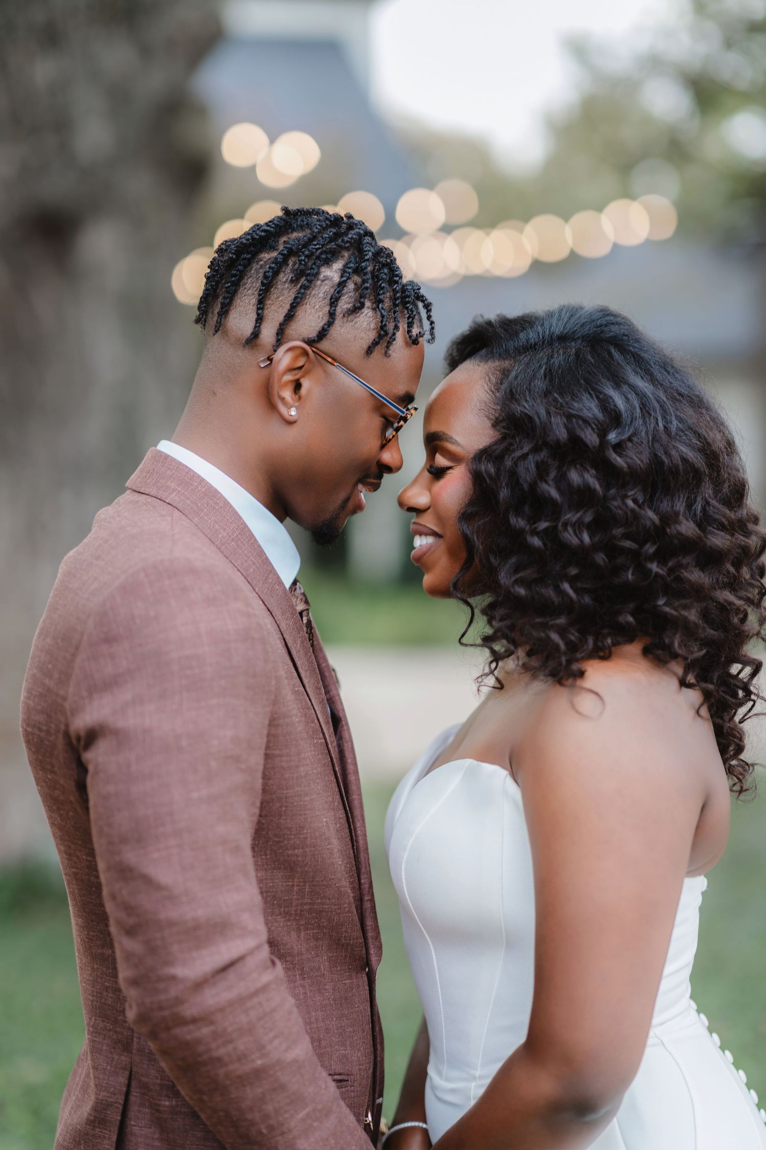 A romantic wedding photoshoot sequence showing tender moments between a couple in brown suit and white dress outdoors.