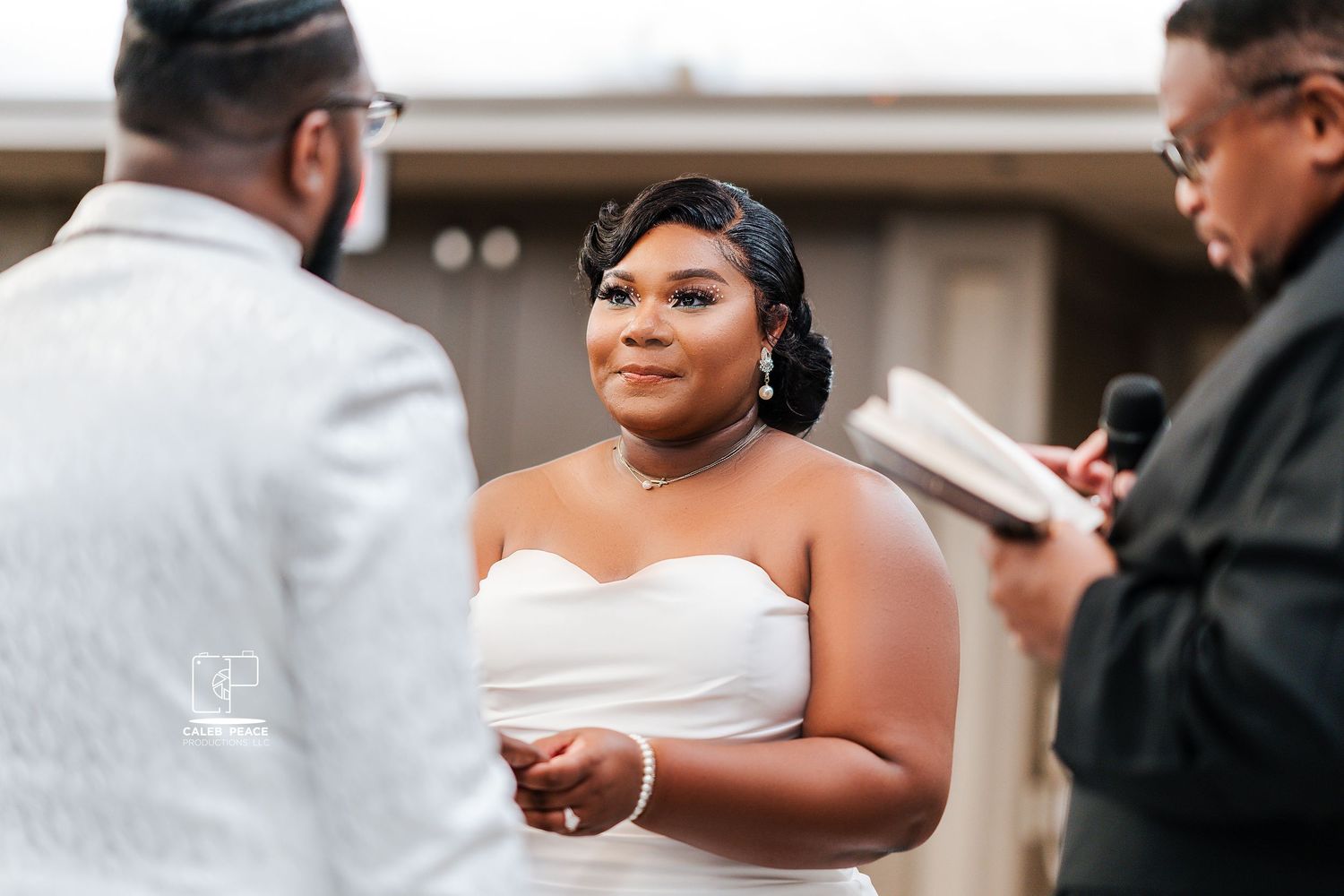 Wedding ceremony moments with elegant white and black attire.
