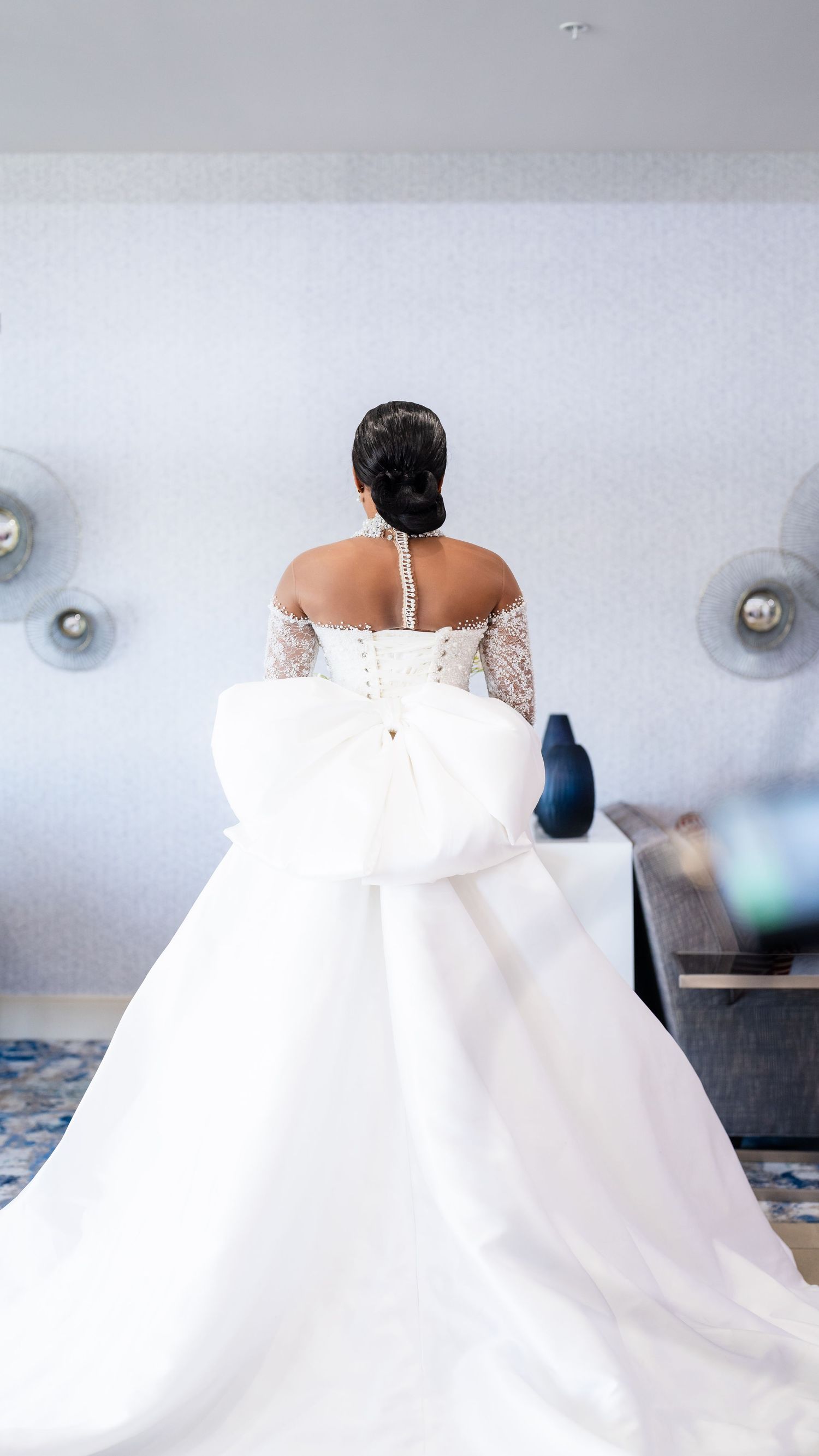 A flowing white wedding dress captured in a series of detail shots showing movement and elegant fabric.