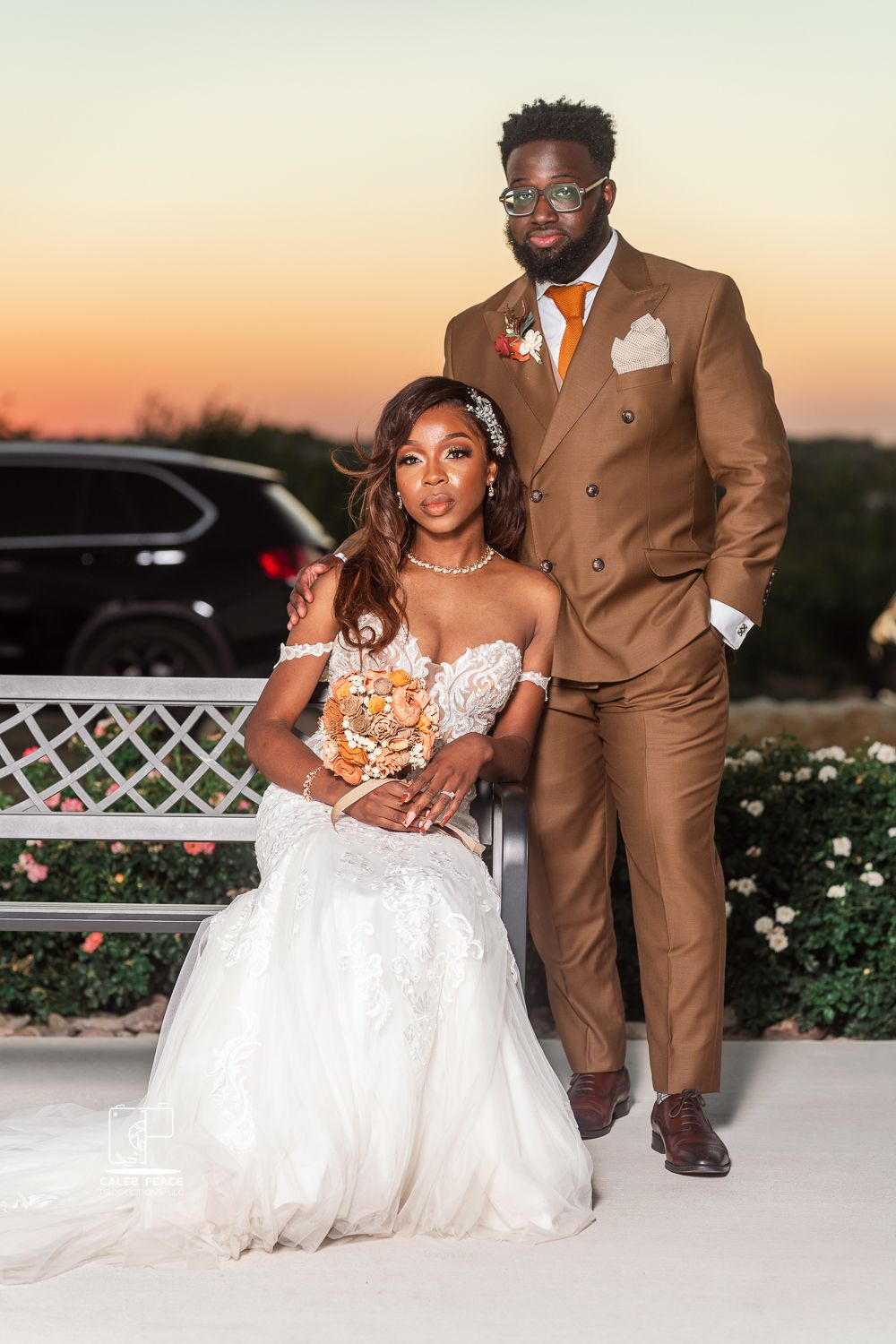 Romantic sunset wedding photos featuring a white gown and brown suit on an outdoor terrace.