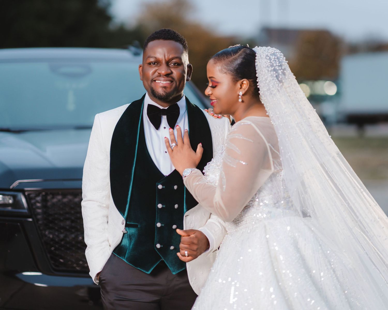 Elegant wedding couple shares intimate moments in formal attire during their outdoor photo session.