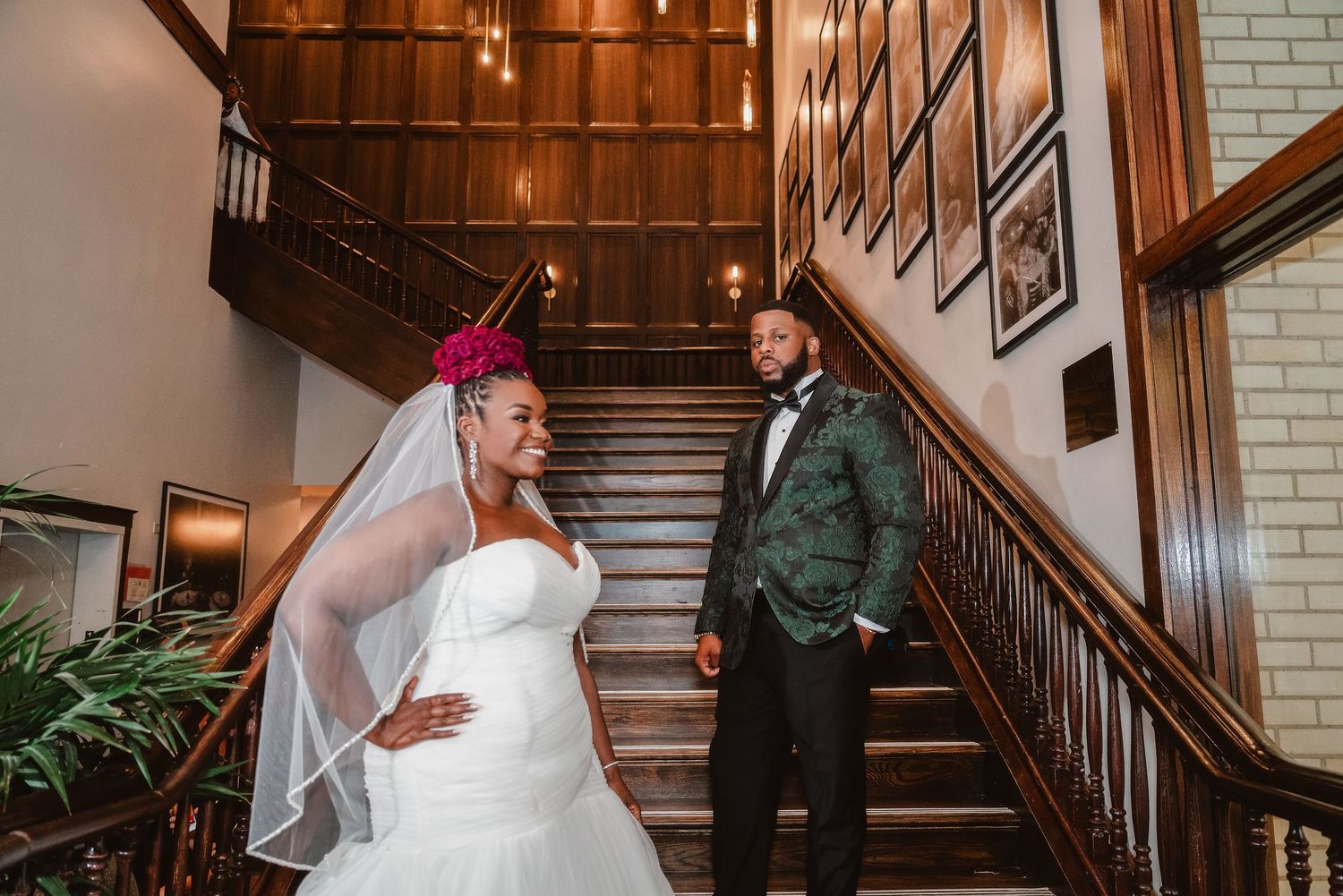 A romantic first look moment between a couple on their wedding day in an elegant indoor venue.