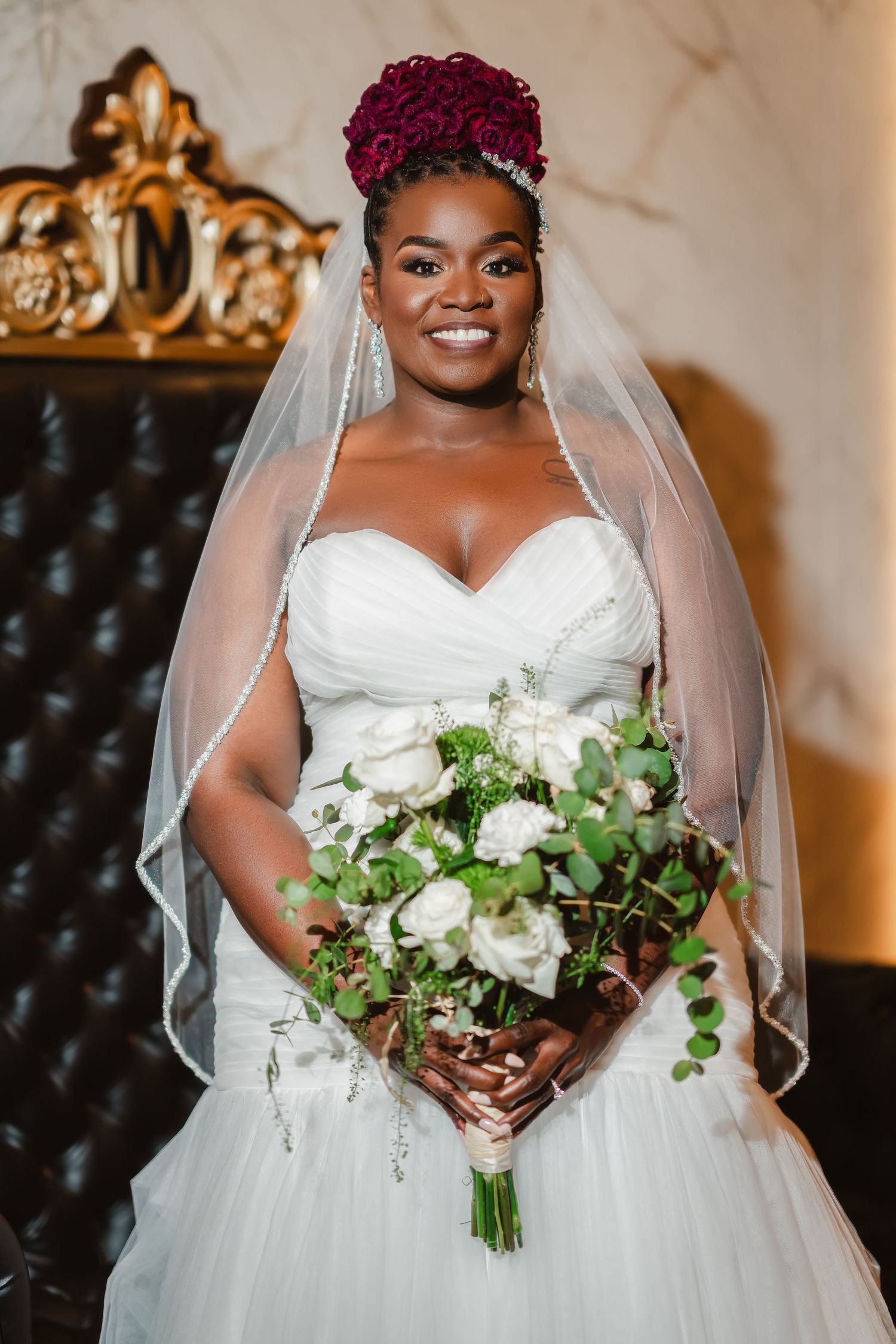 Wedding photos showing a beautiful white bouquet and elegant bridal details against luxurious decor.