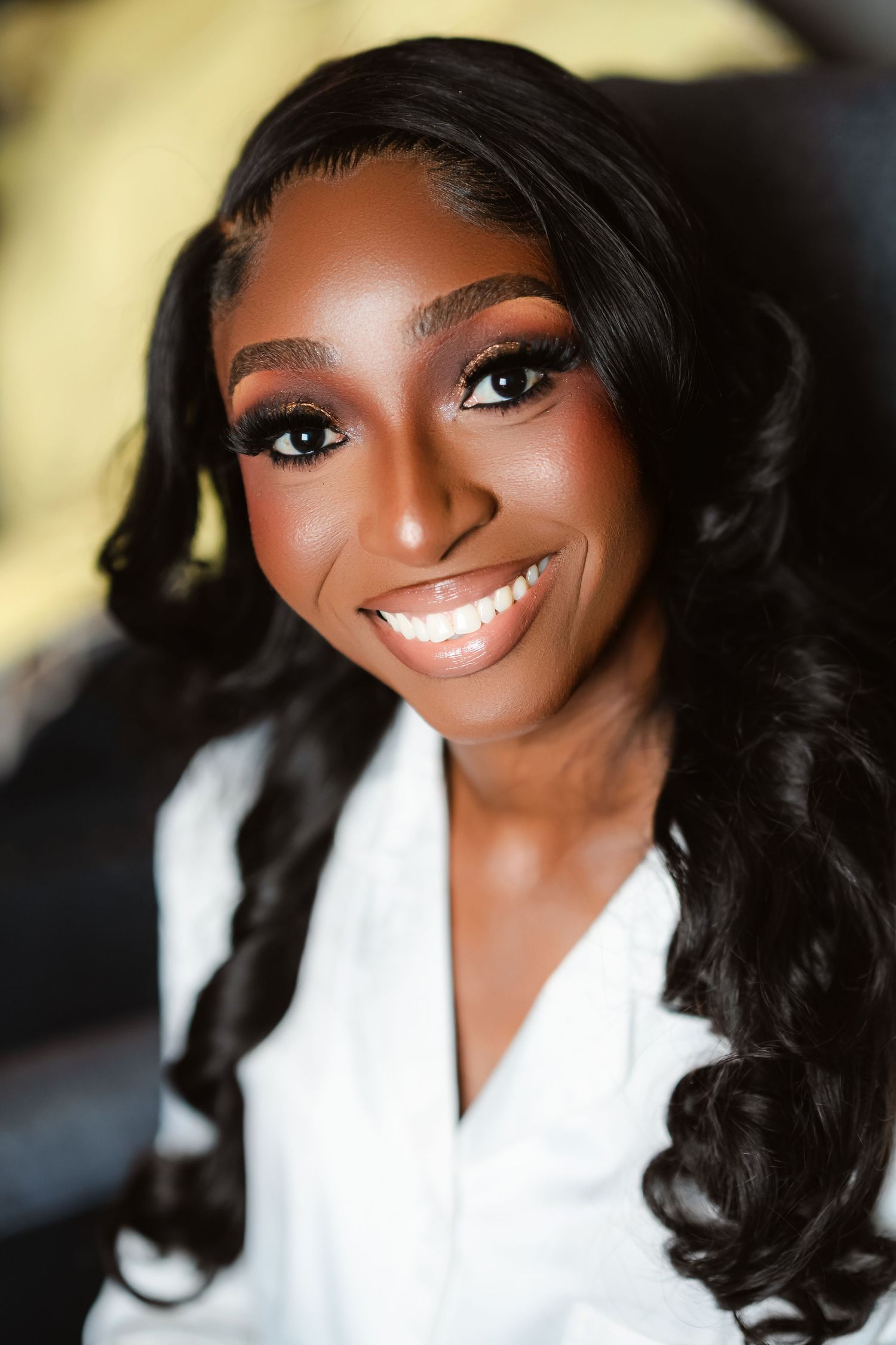 A series of glamour portraits showing a radiant smile in a white top against a dark background.