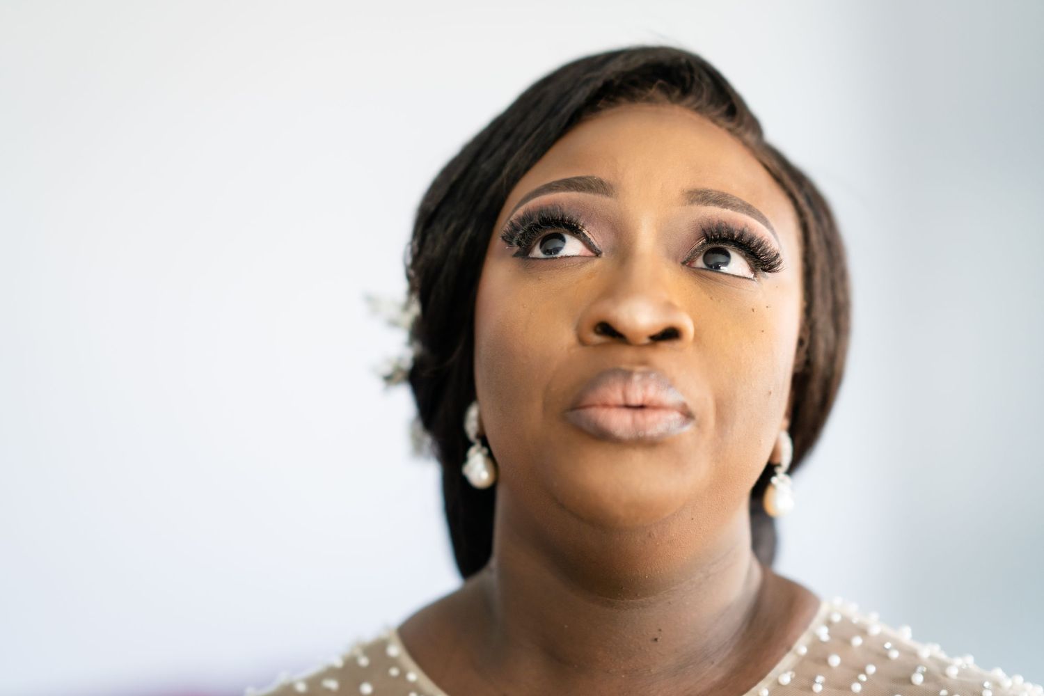 Close-up shots of bridal makeup and glamorous wedding day preparation.