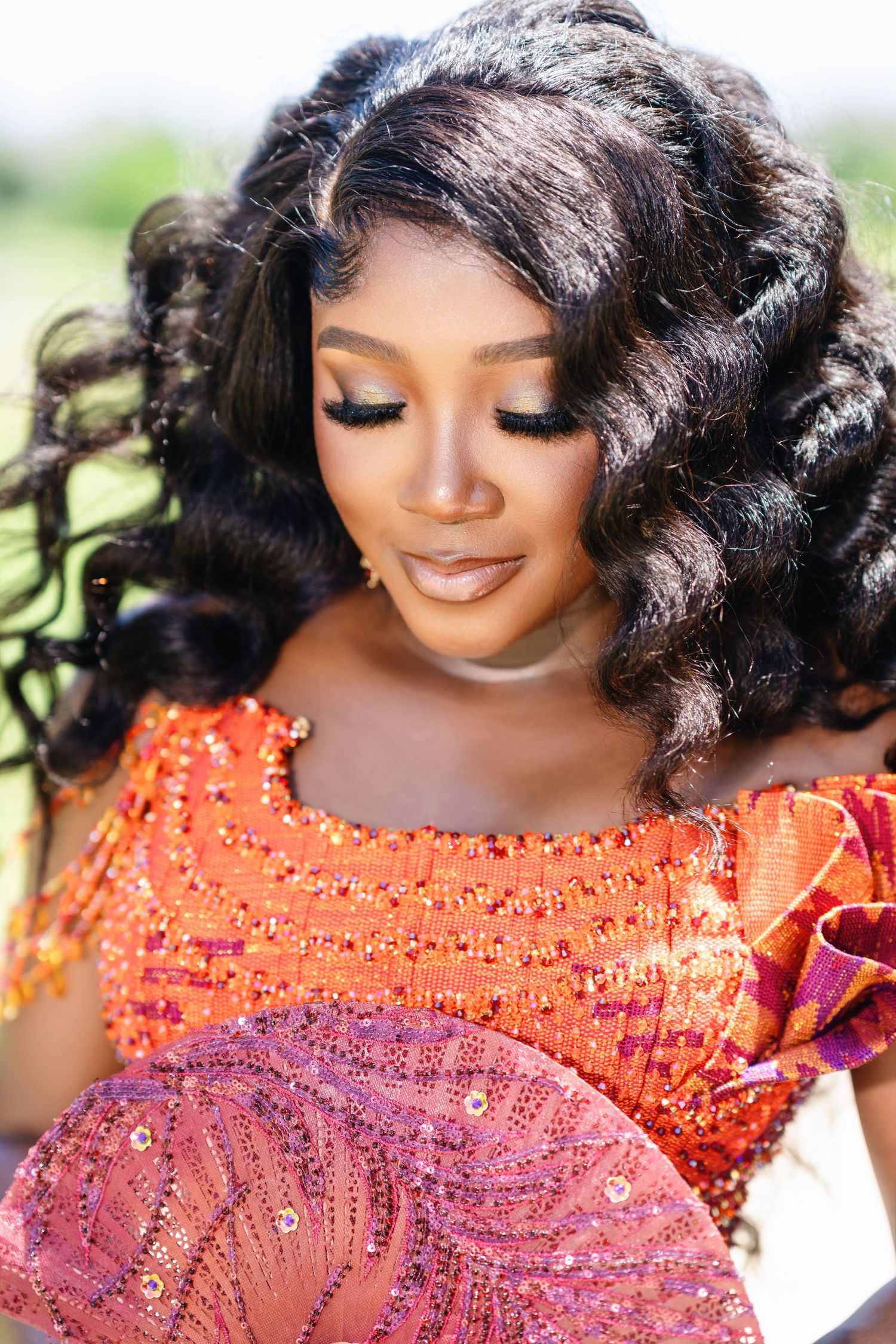 Close-up beauty shots showing detailed beadwork on orange formal dress.