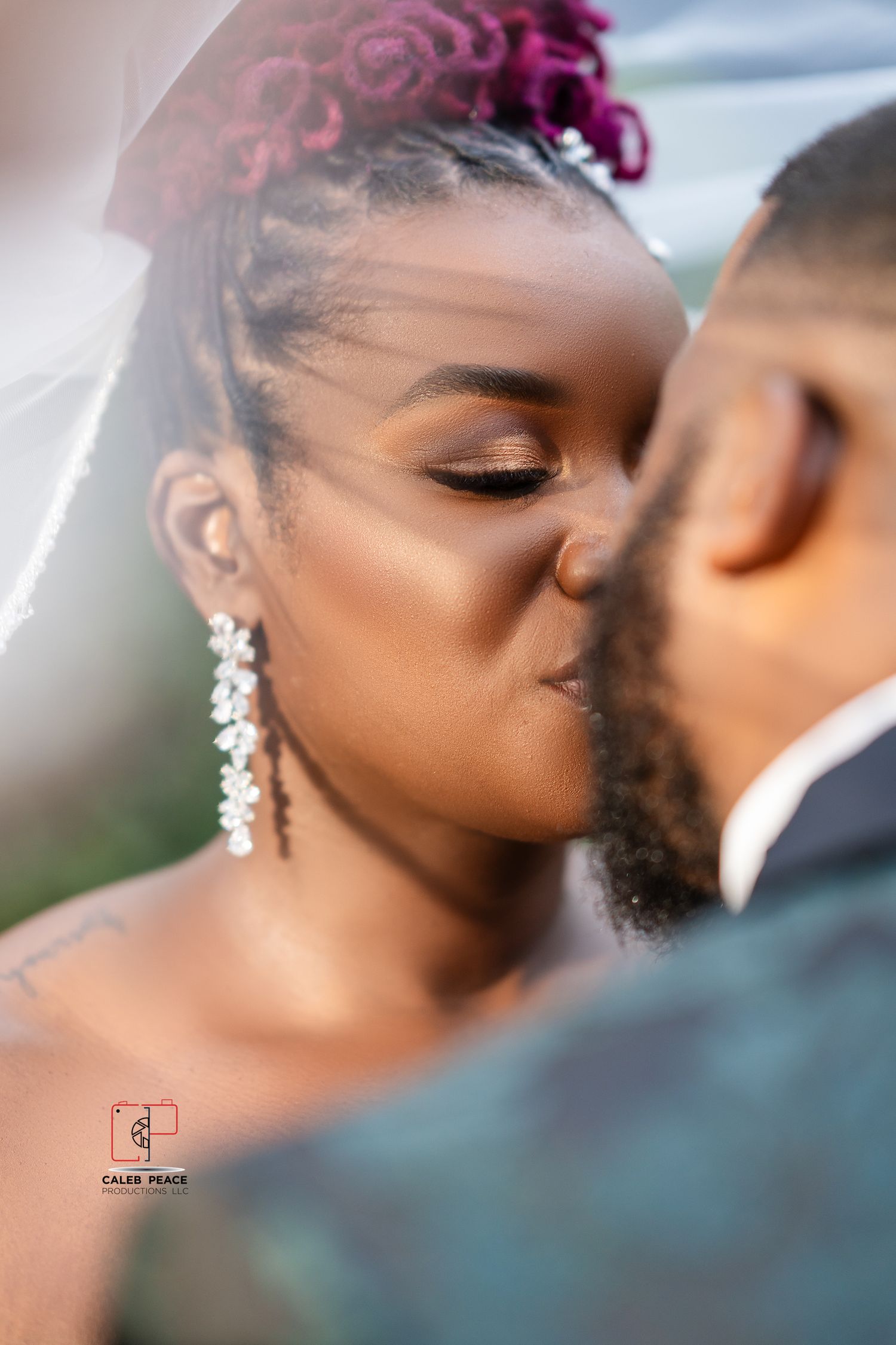 A close-up romantic moment captured between newlyweds, with sparkling earrings and soft makeup details visible.